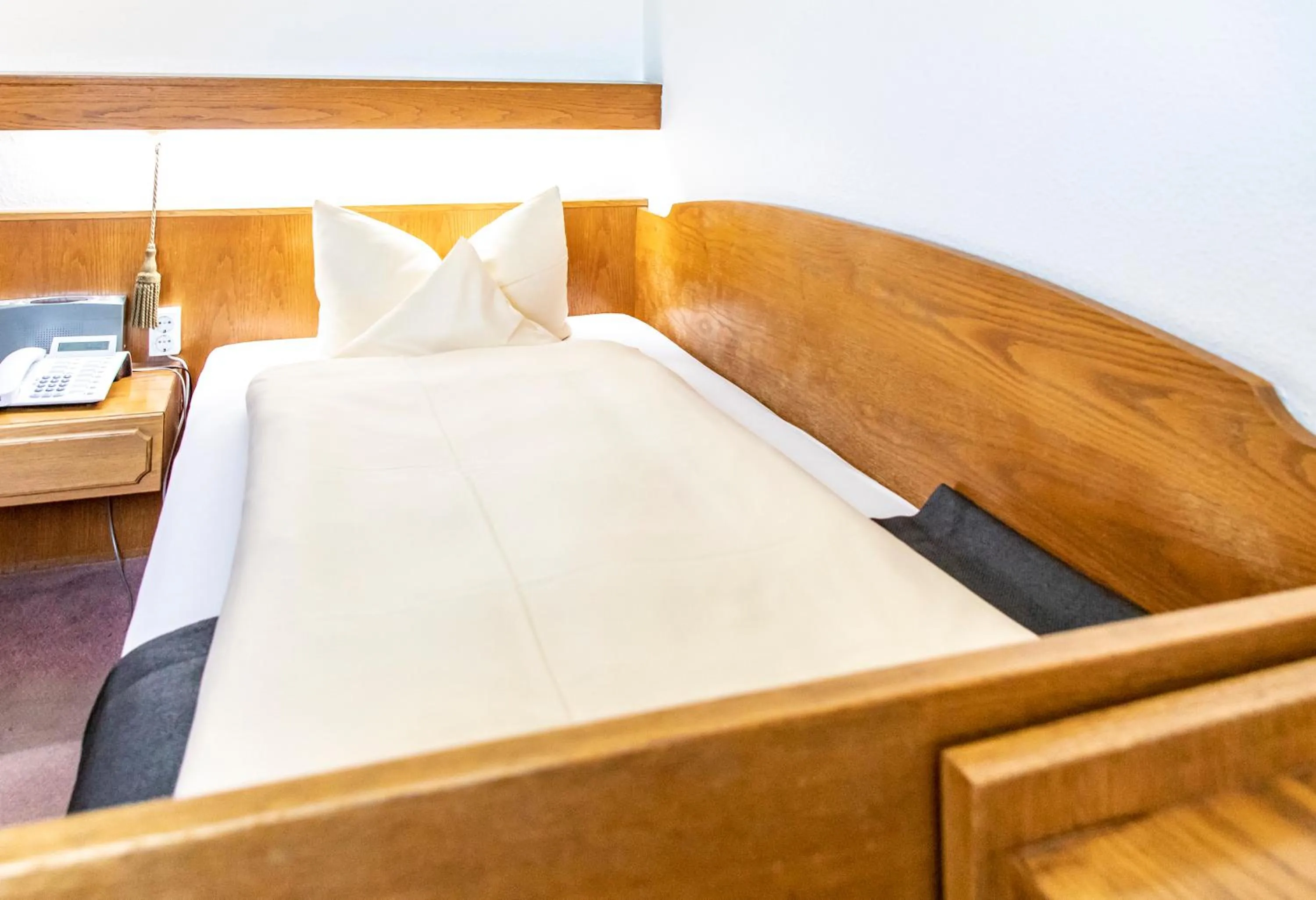 Photo of the whole room, Bed in Hotel JÄGERHAUS in Singen am Hohentwiel