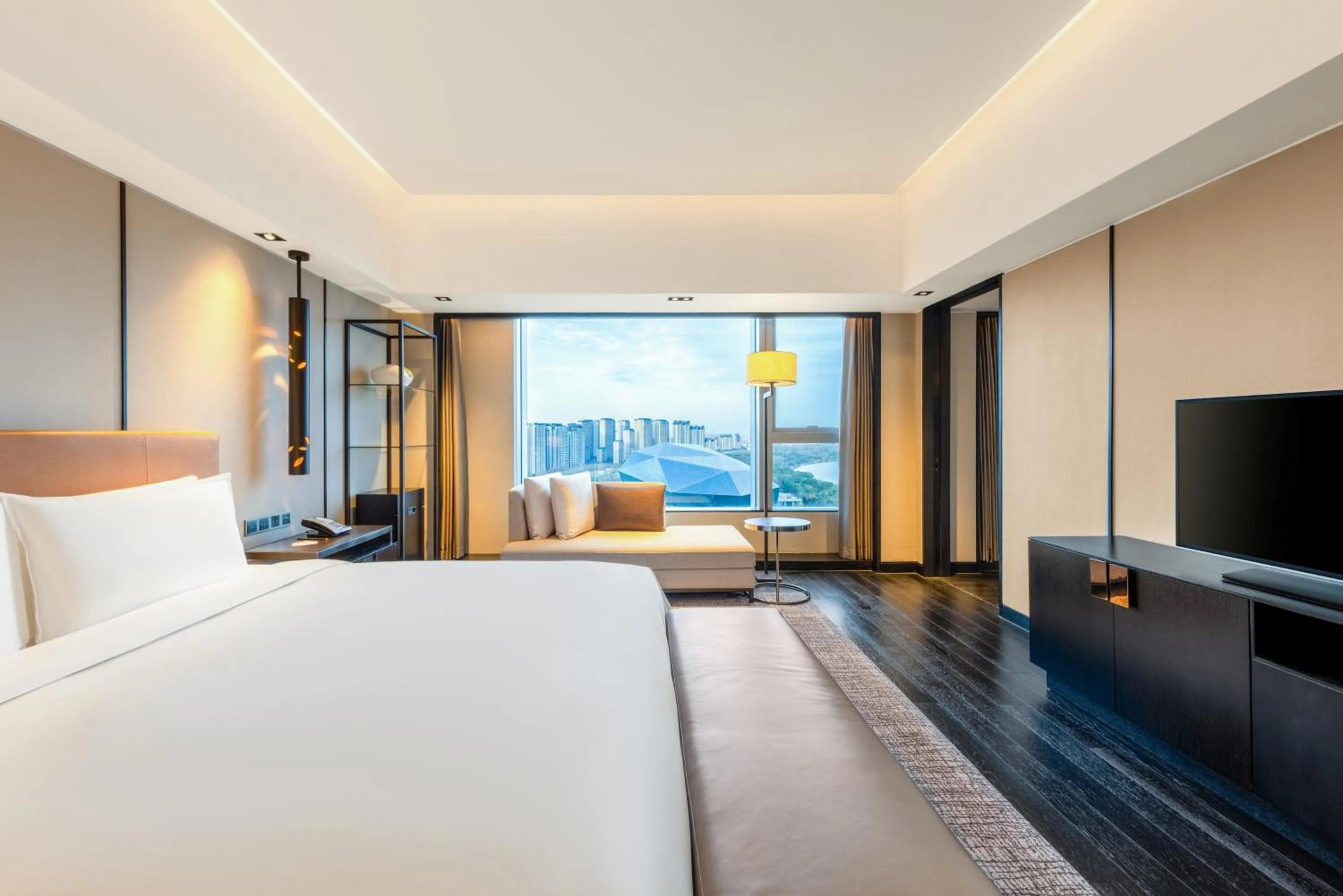 Bed in New World Shenyang Hotel