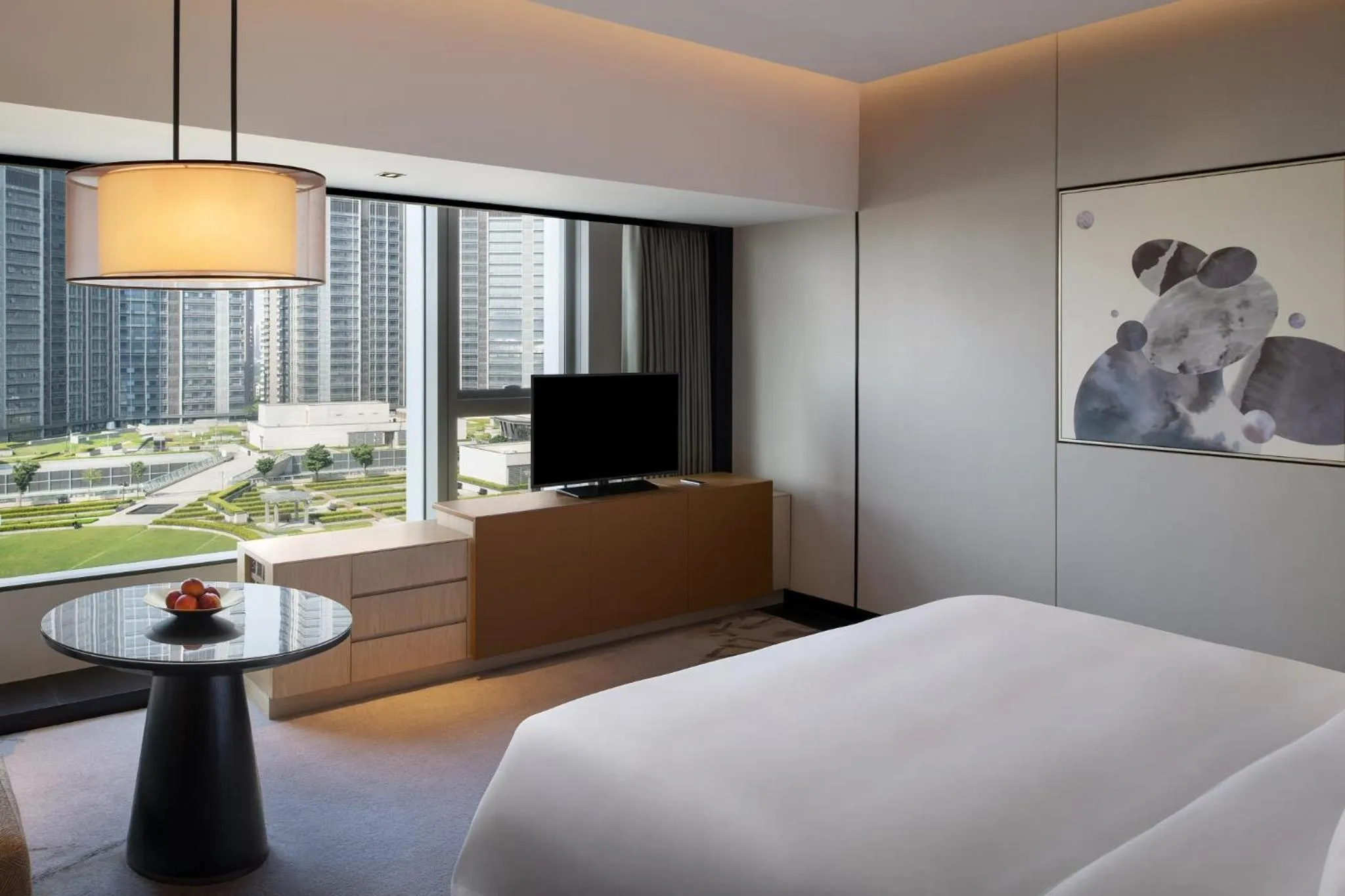 Bed in New World Shenyang Hotel