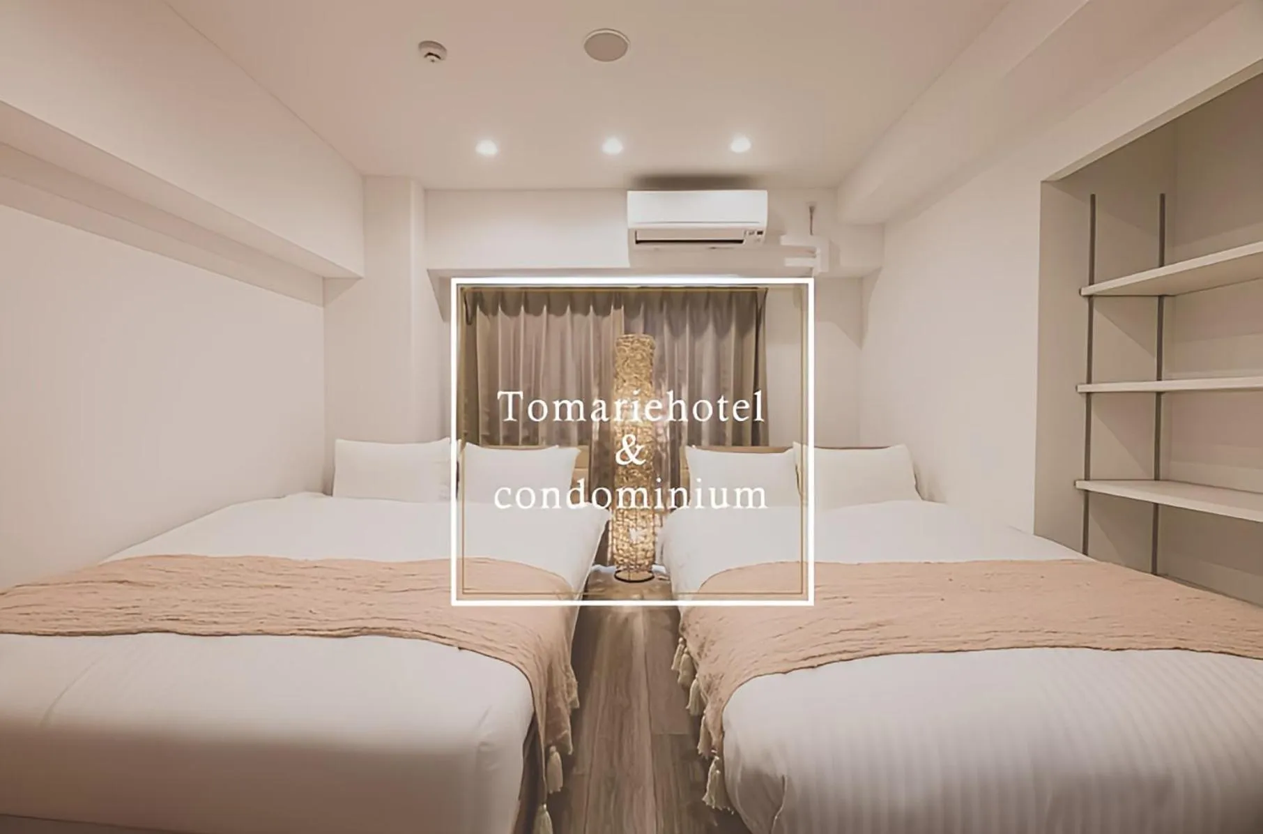 Text overlay, Bed in Tomariehotel & condominium