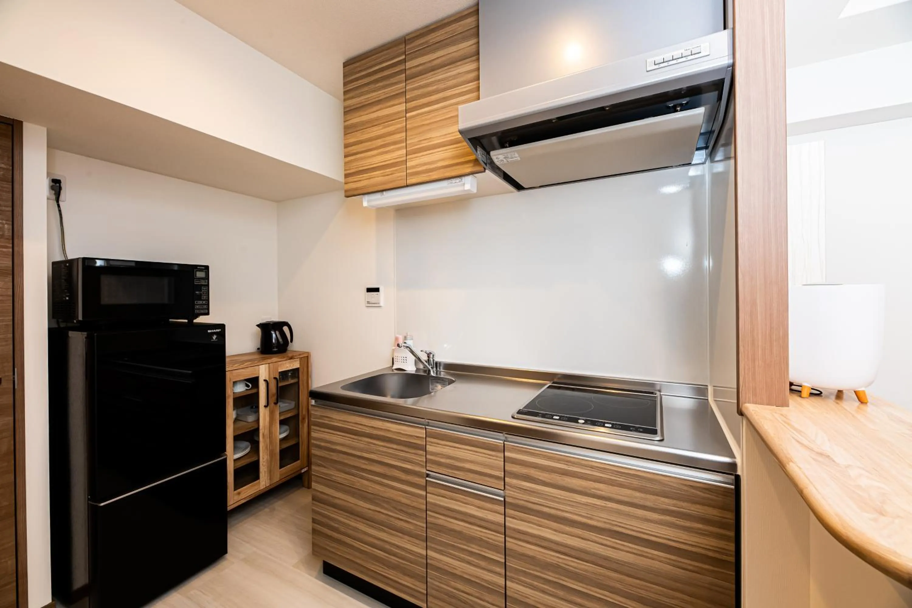 Kitchen or kitchenette in Tomariehotel & condominium