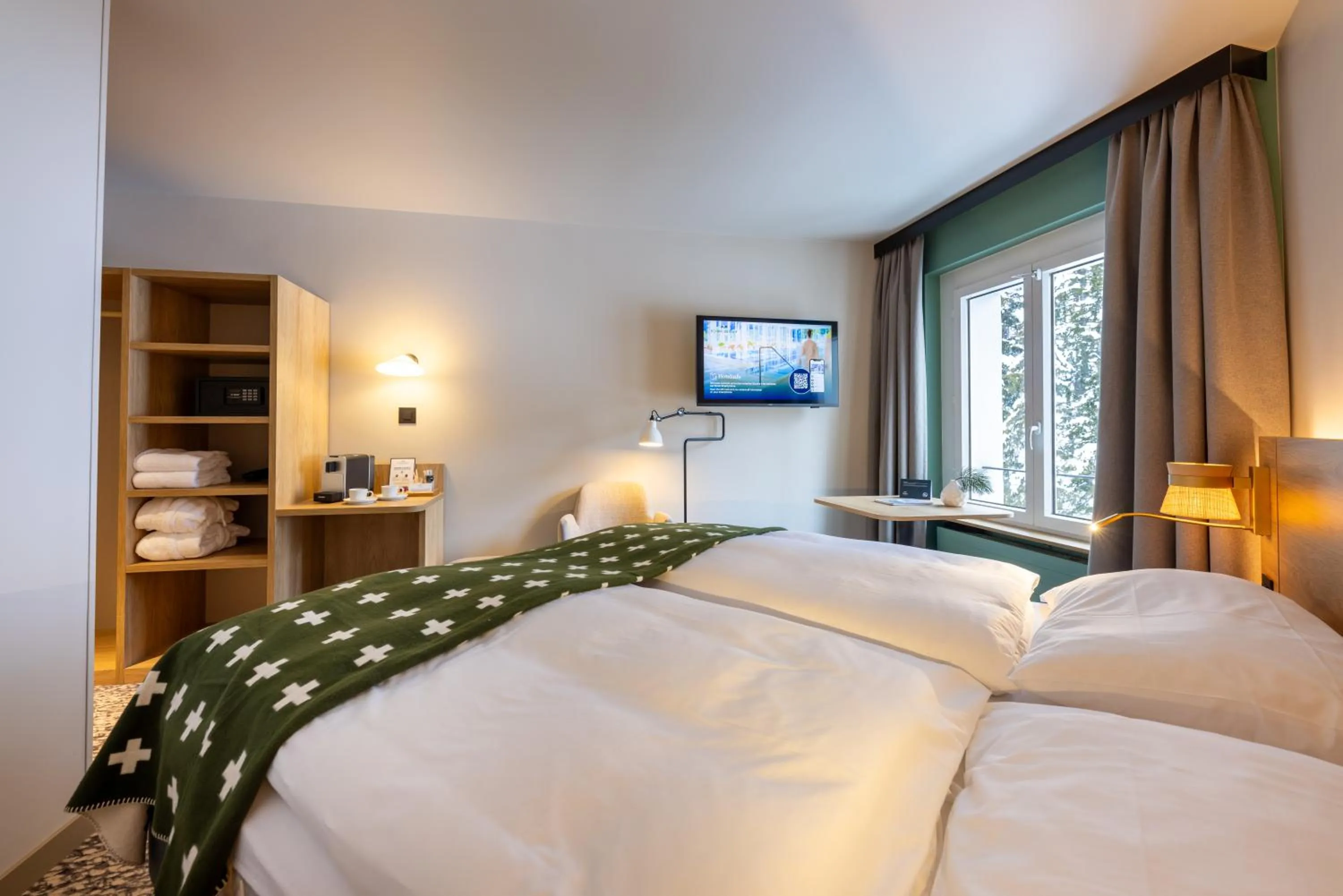 Bed in Hotel Schweizerhof Sils Maria, a Faern Collection Hotel