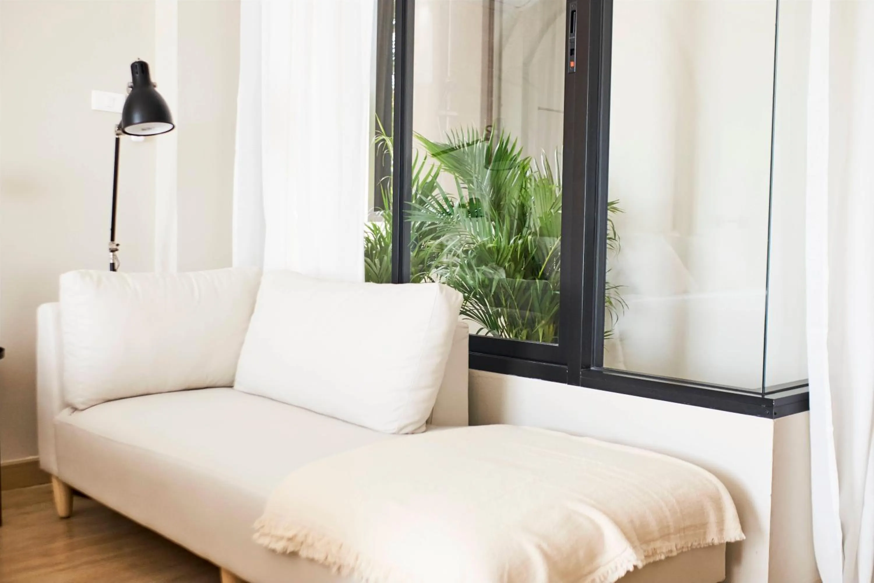 Seating area, Bed in Dream Nimman Apartment