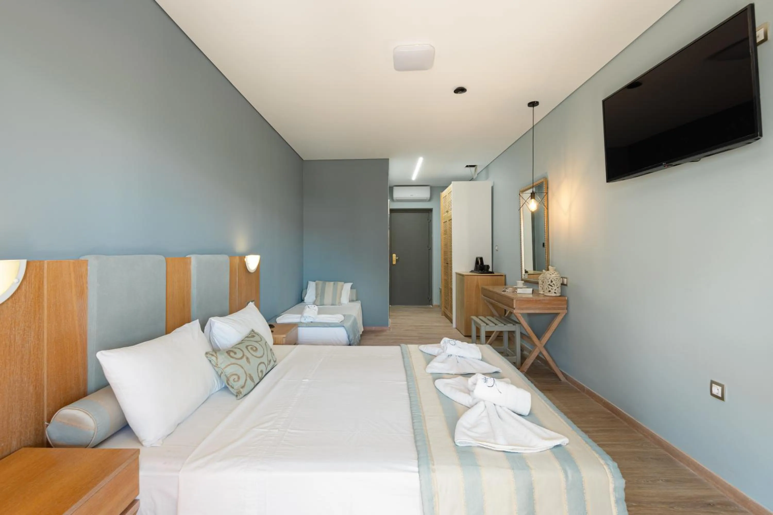 Bed in Regos Resort Hotel