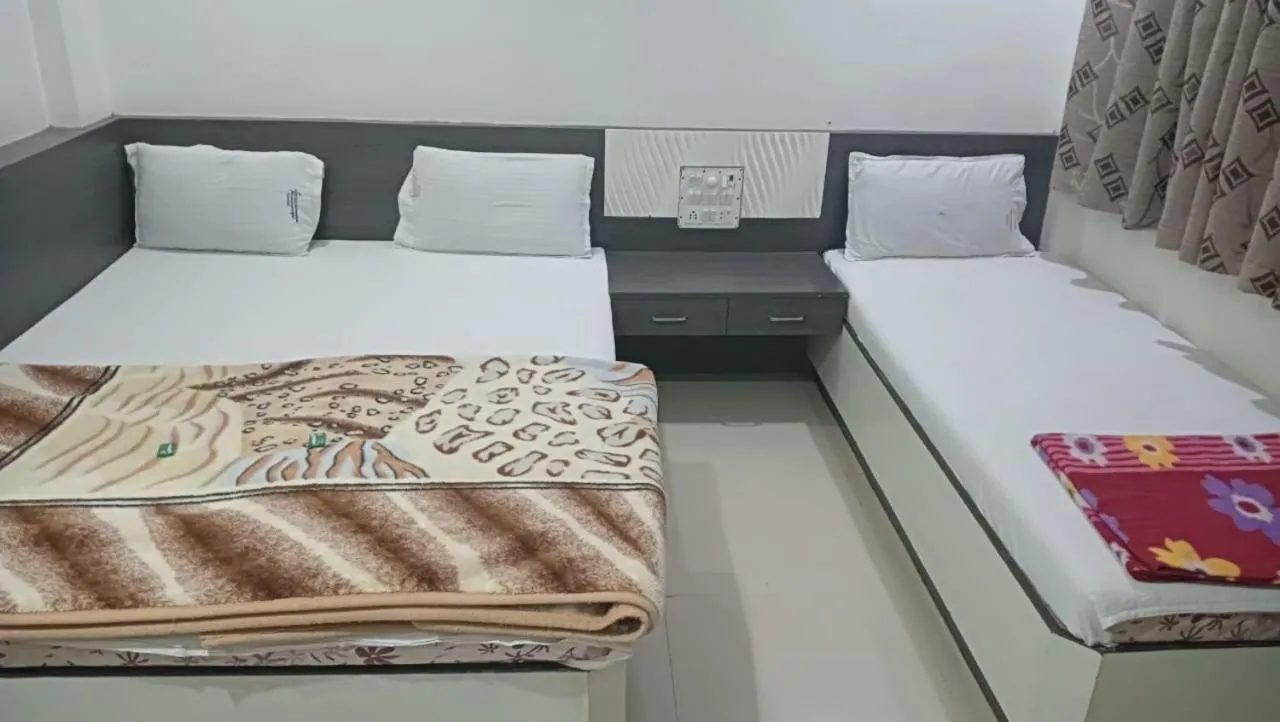 Bed in Hotel Shri Sai Darshan