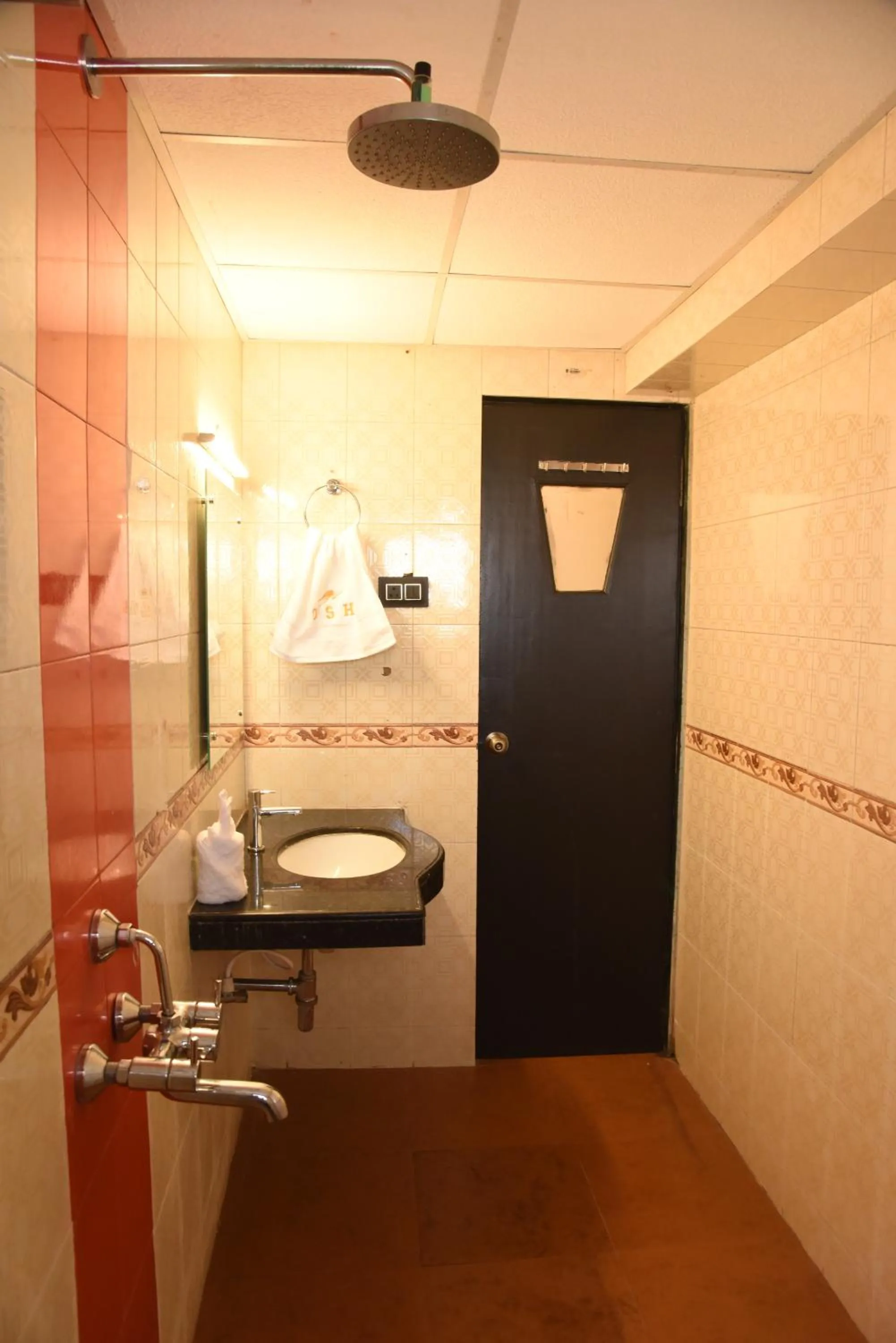 Bathroom in Om Shiv Hotel