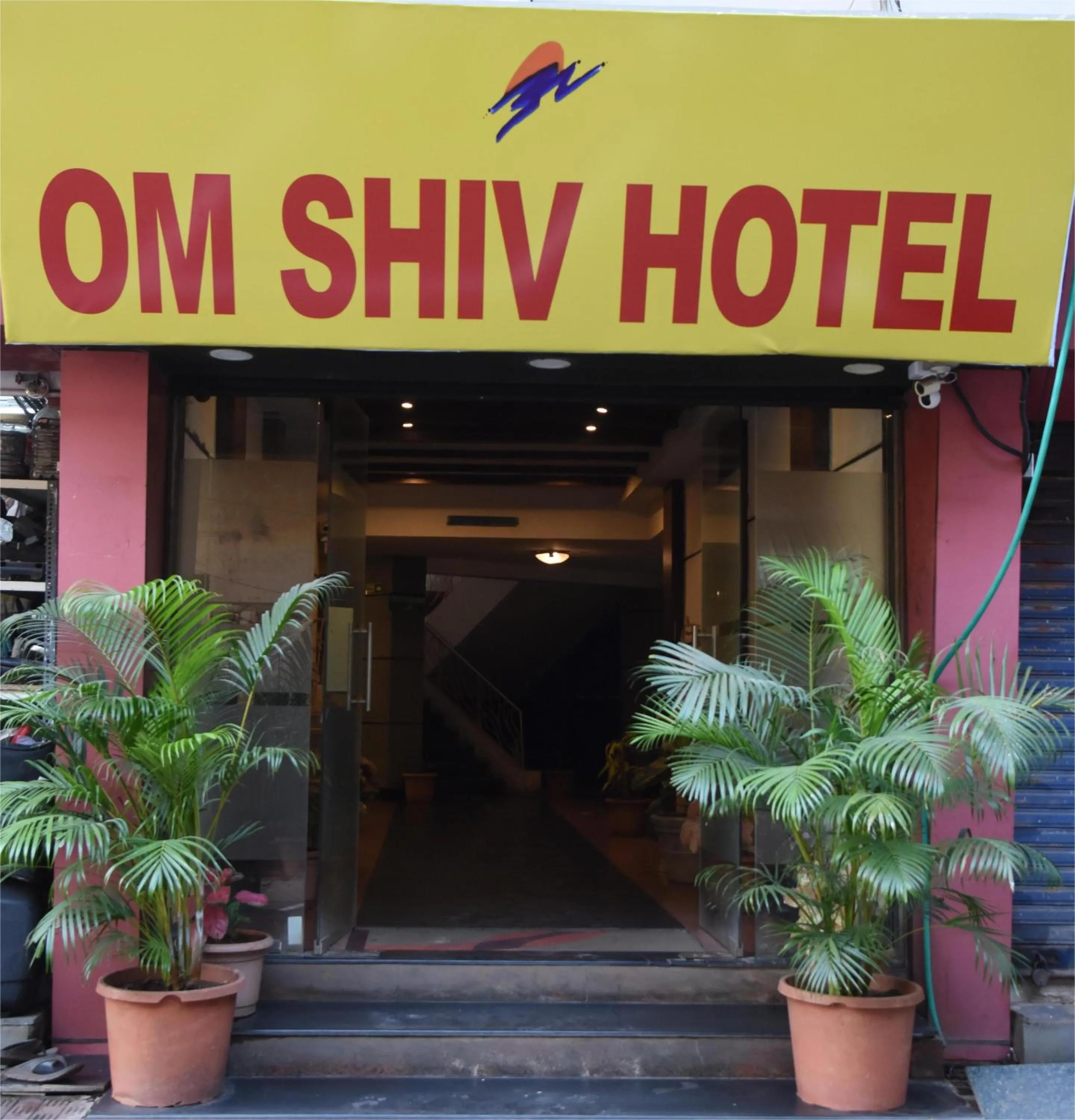 Property logo or sign in Om Shiv Hotel