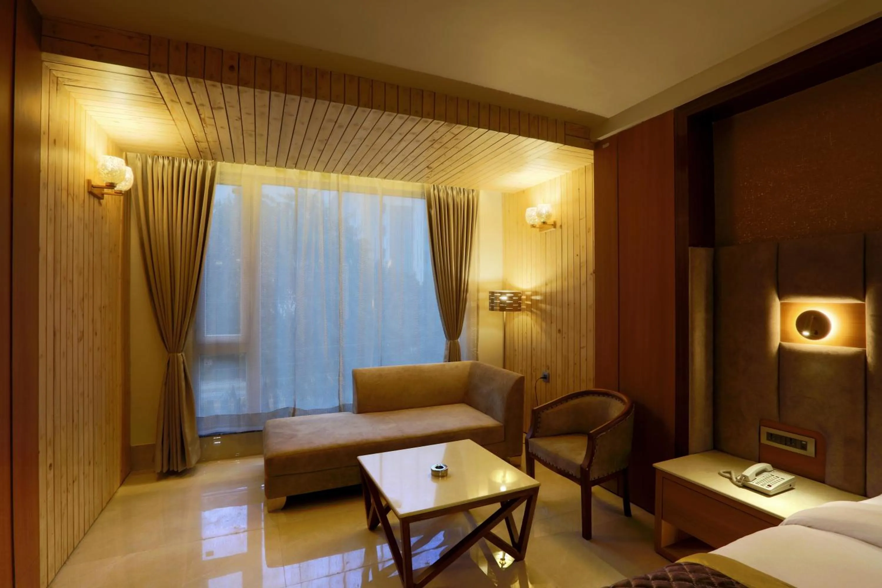 Seating area, Bed in Hotel Omega - Gurgaon Central, Sec 45