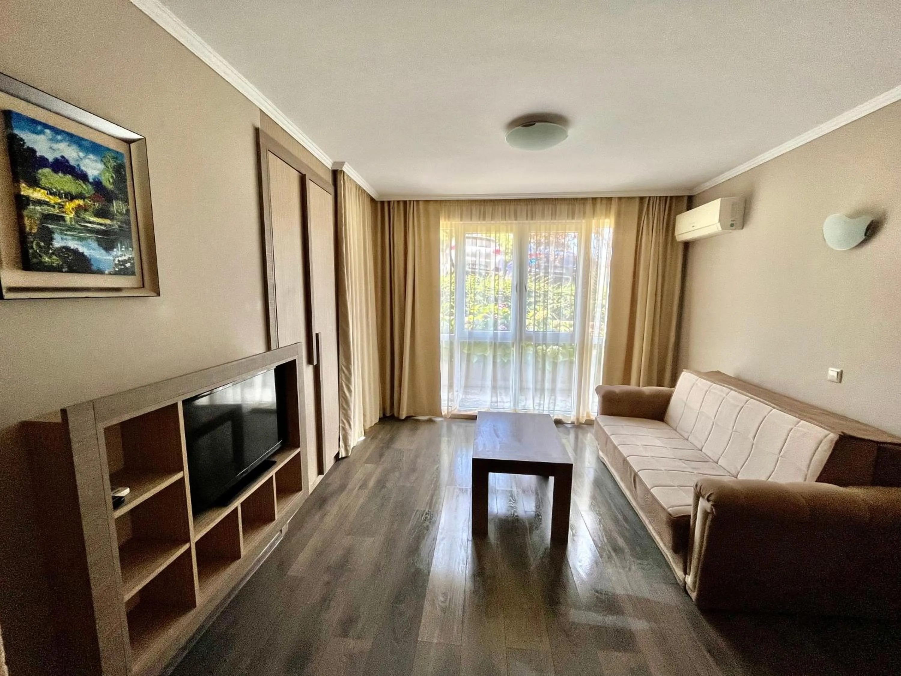 Communal lounge/ TV room in Villa Orange
