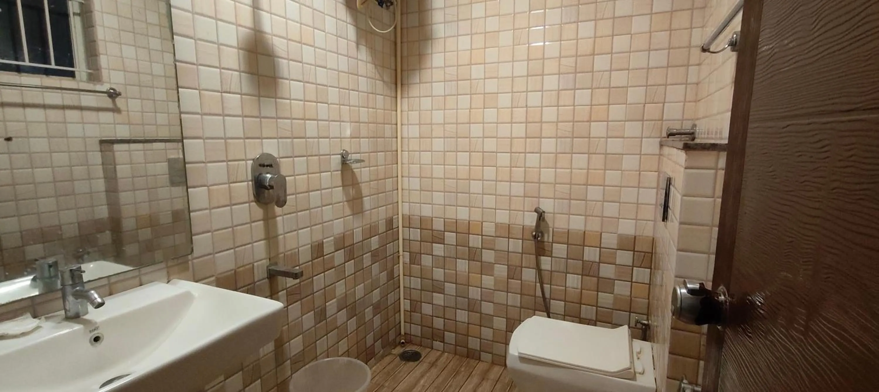 Bathroom in Hotel Dhruv Palace Bangalore Jakkur