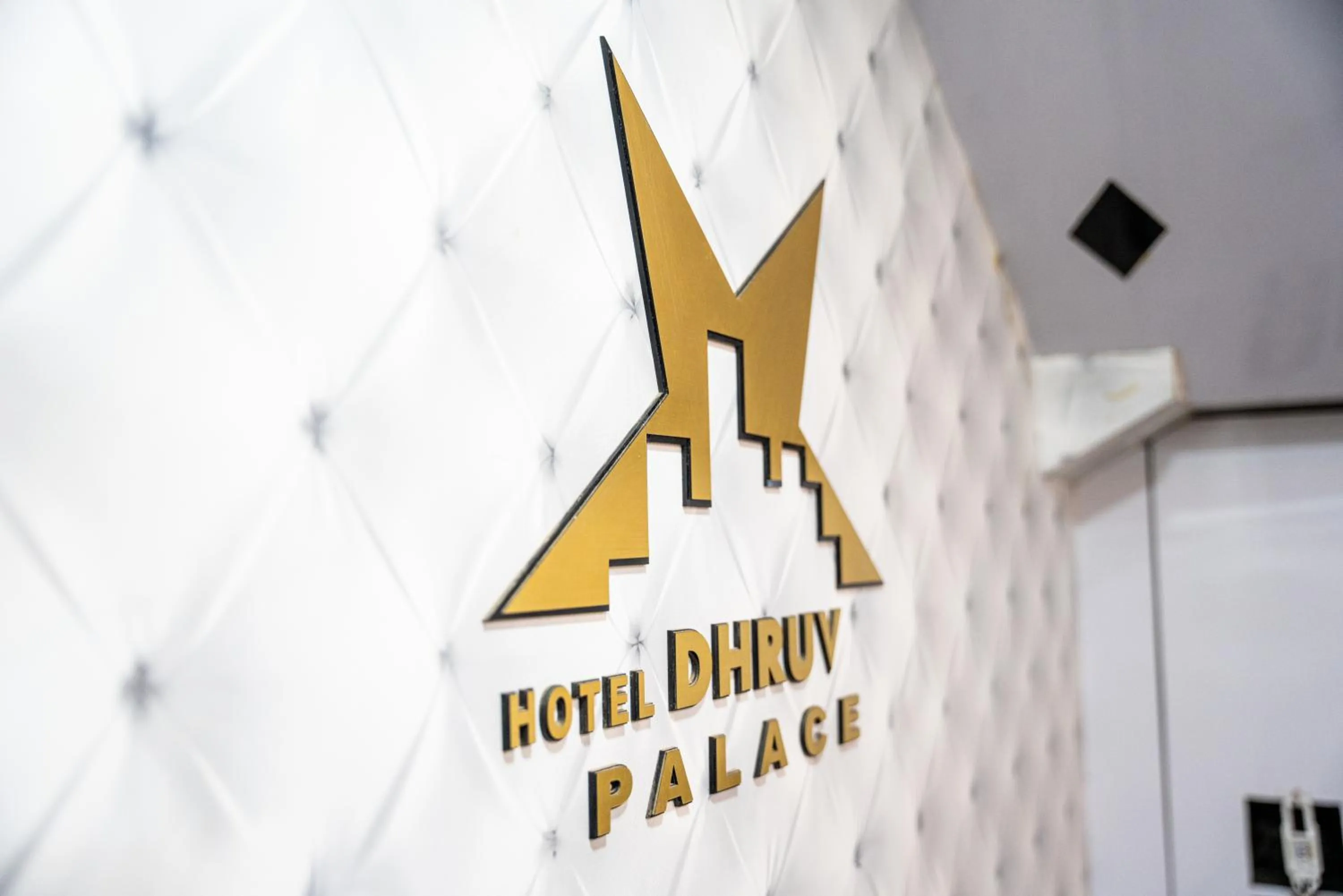 Property logo or sign in Hotel Dhruv Palace Bangalore Jakkur