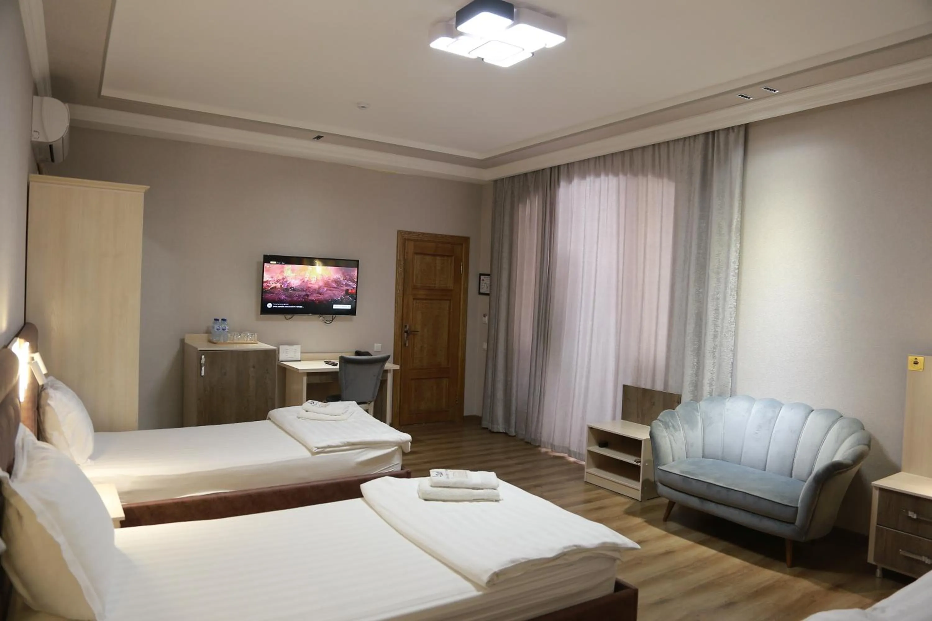 Communal lounge/ TV room, Bed in Asal Boutique Hotel
