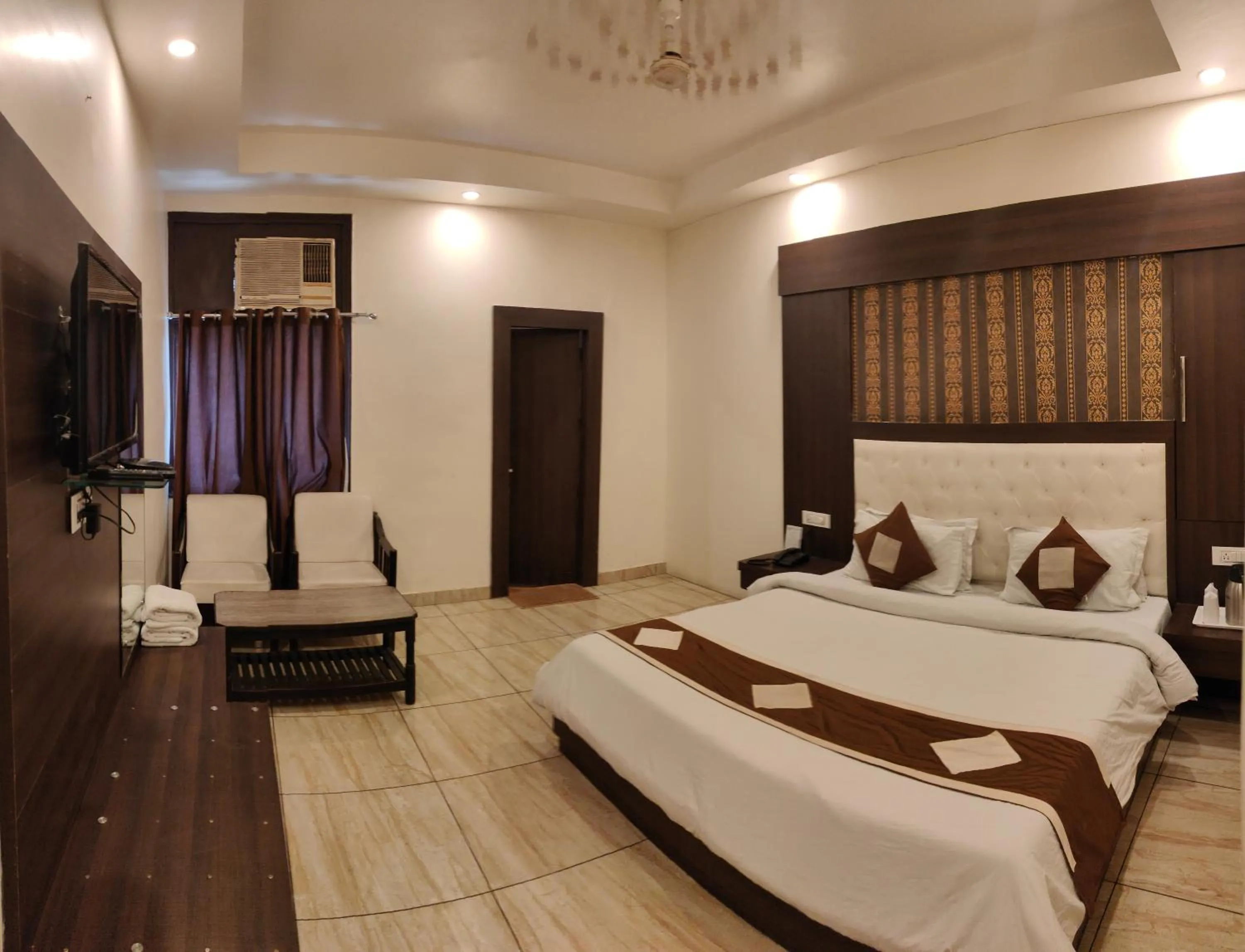 Photo of the whole room, Bed in Hotel Krishna