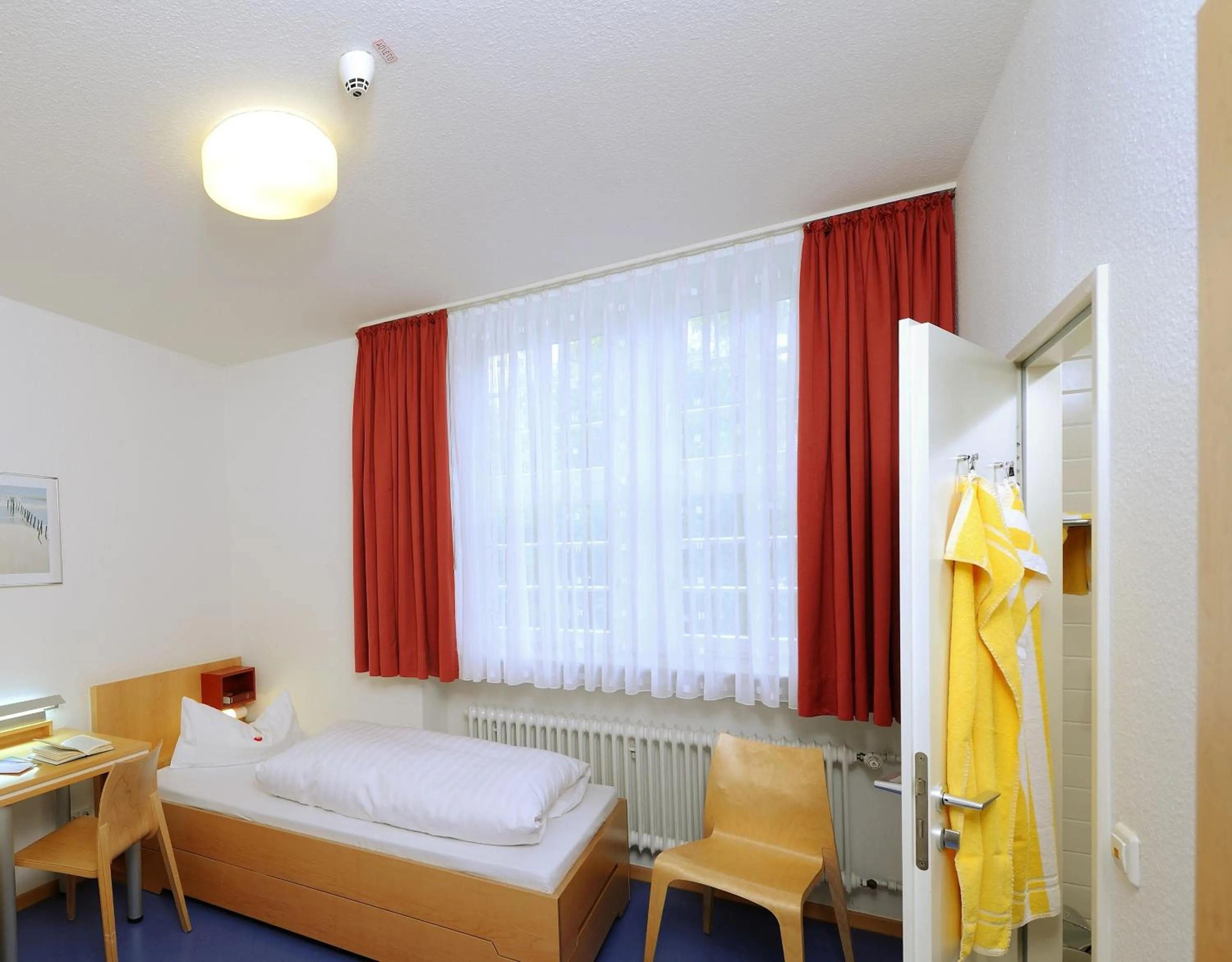 Photo of the whole room, Bed in Bildungshaus Neckarelz