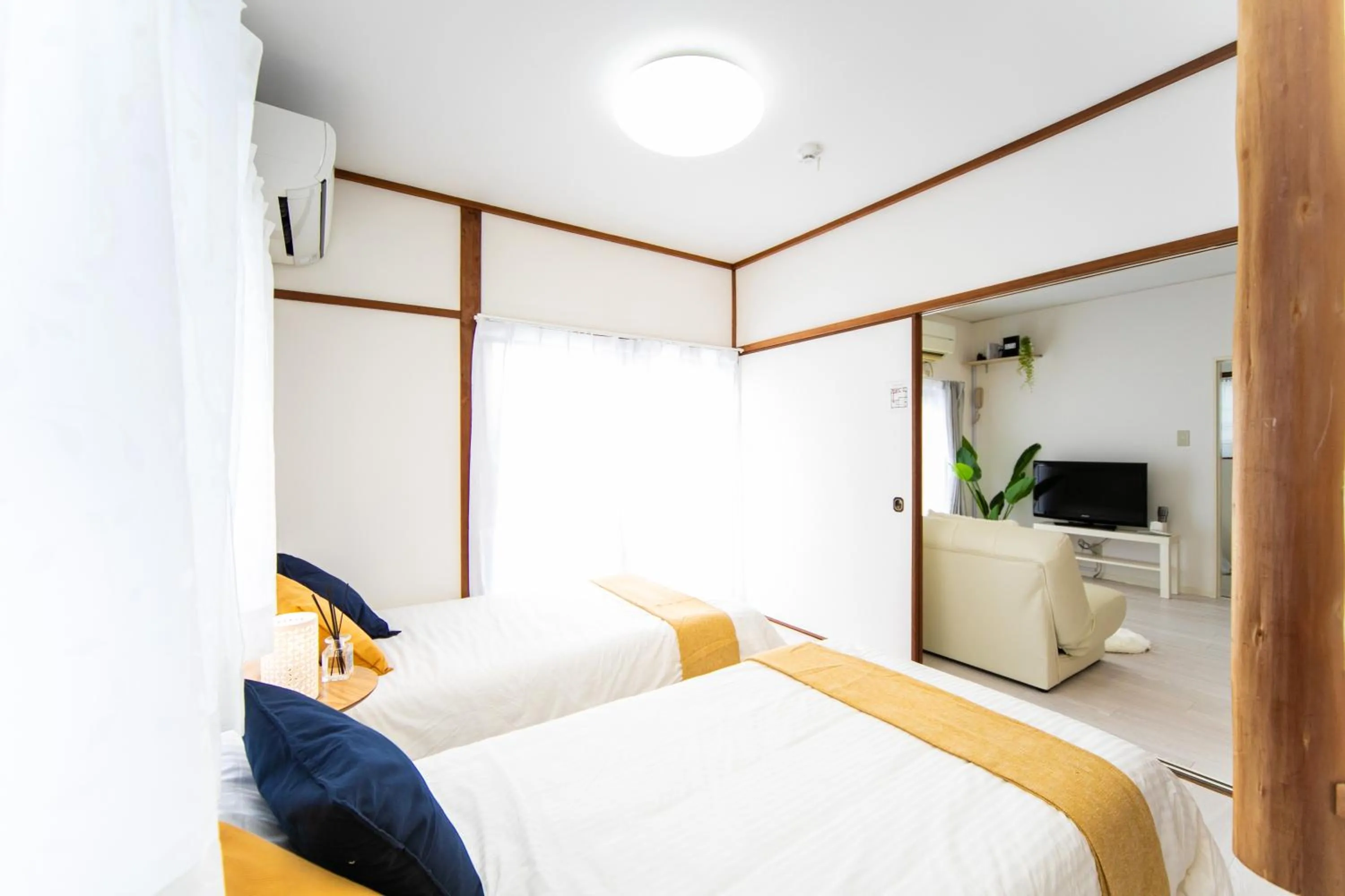 Bed in Takashima Lakeside Resort in Kitage