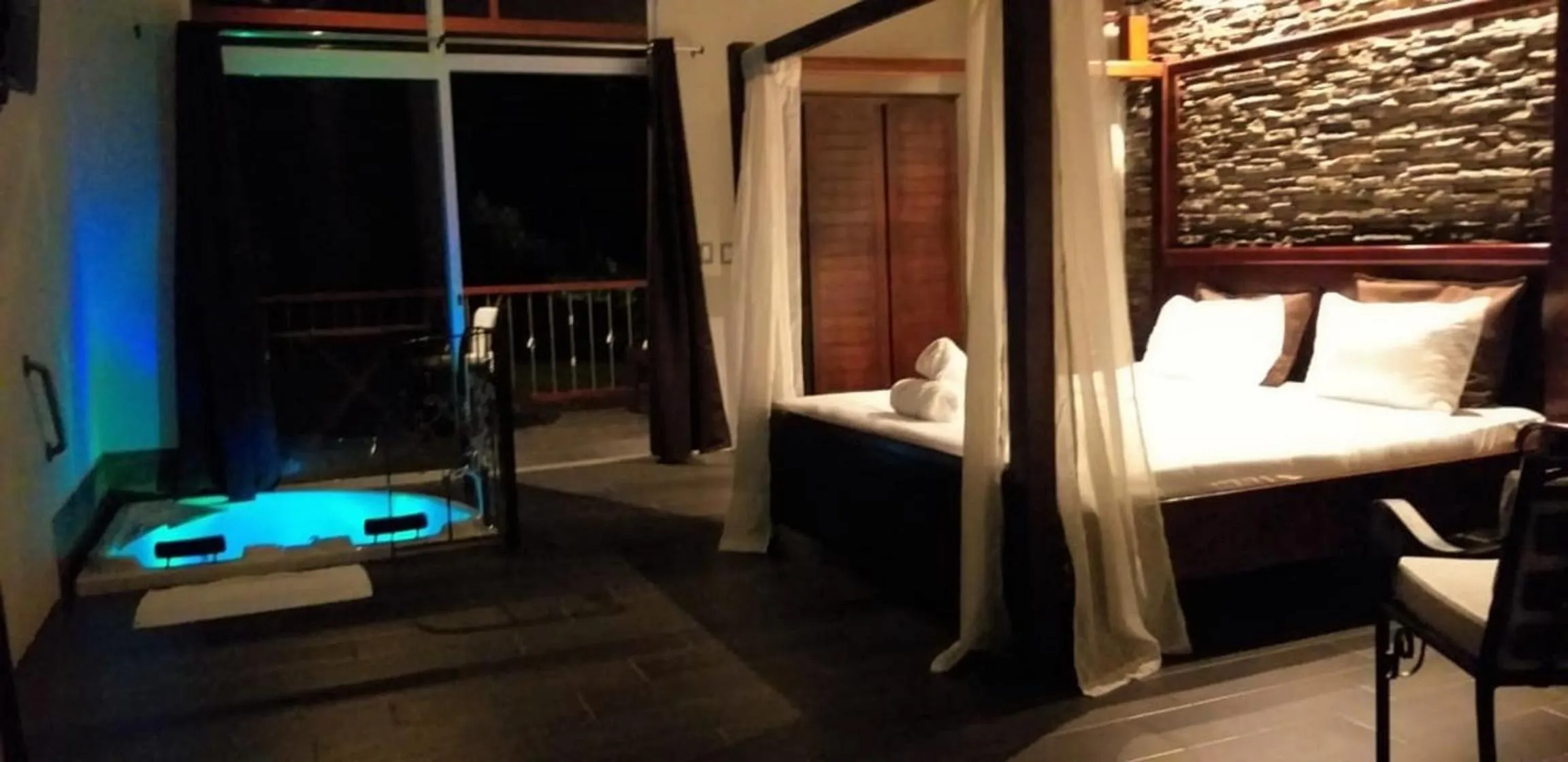 Bed in Tropical Suites & Villas