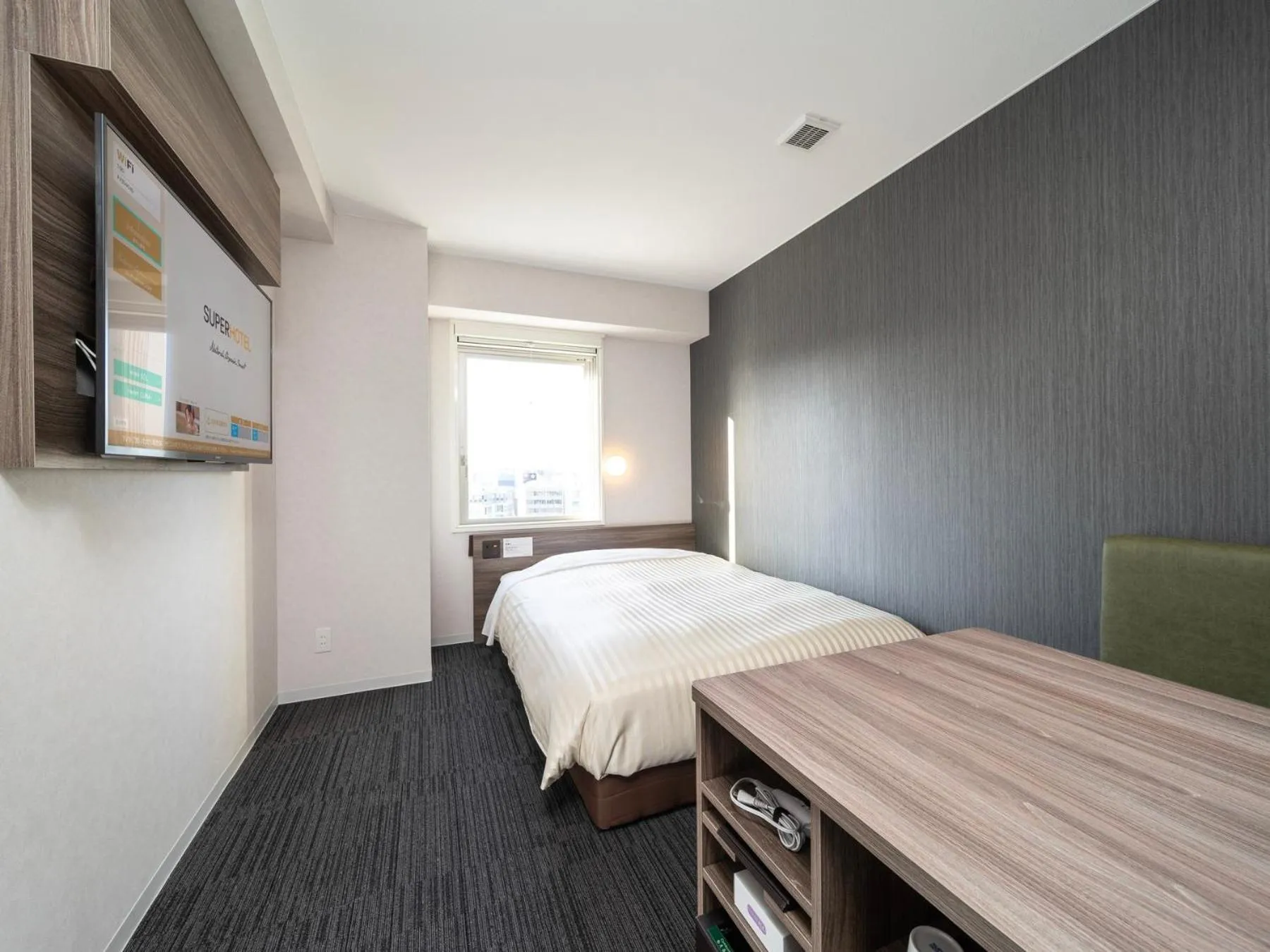 Bed in Super Hotel Hiroshima Yagenboridori