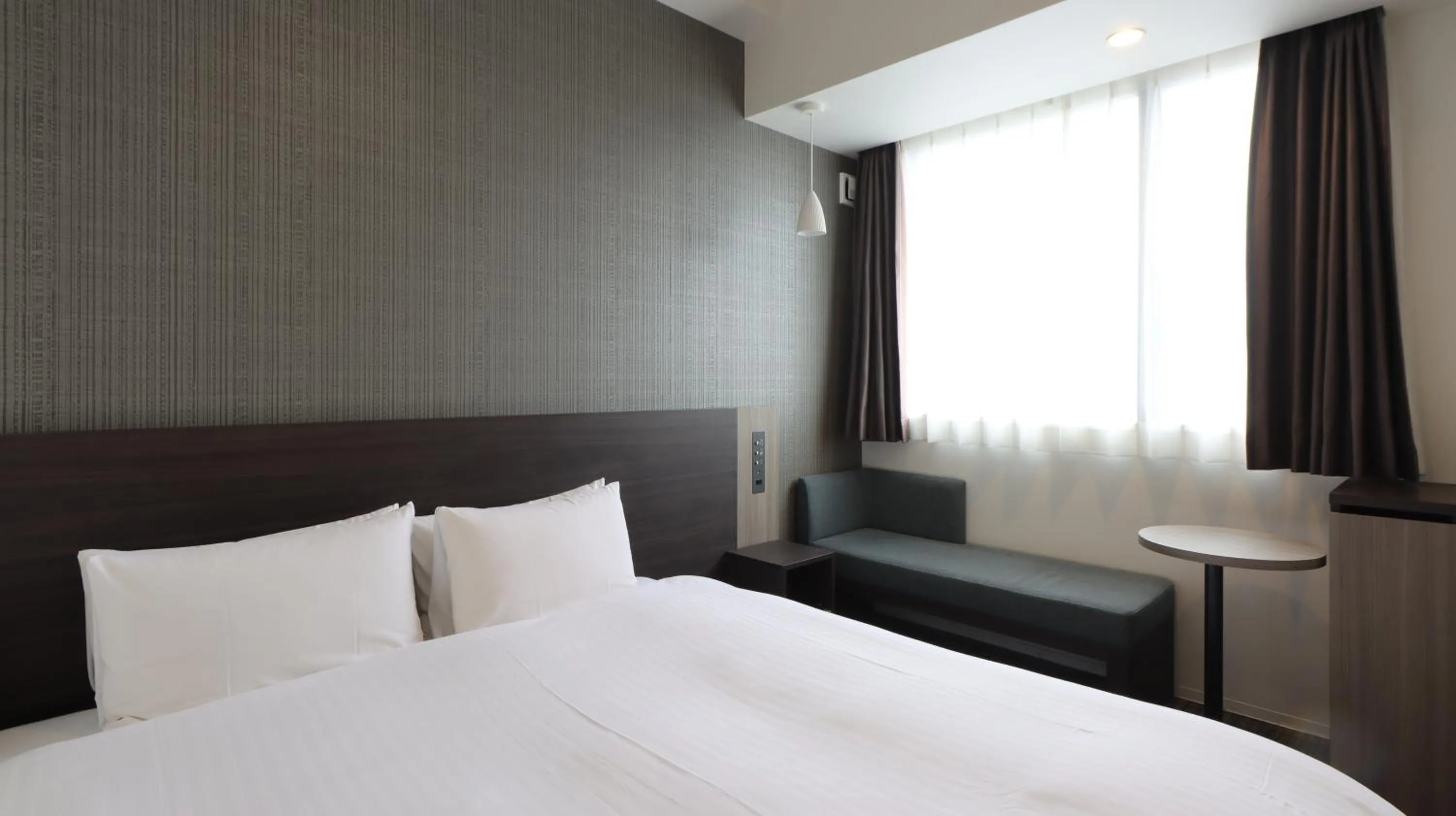 Bed in Wander Kyoto Nanajo