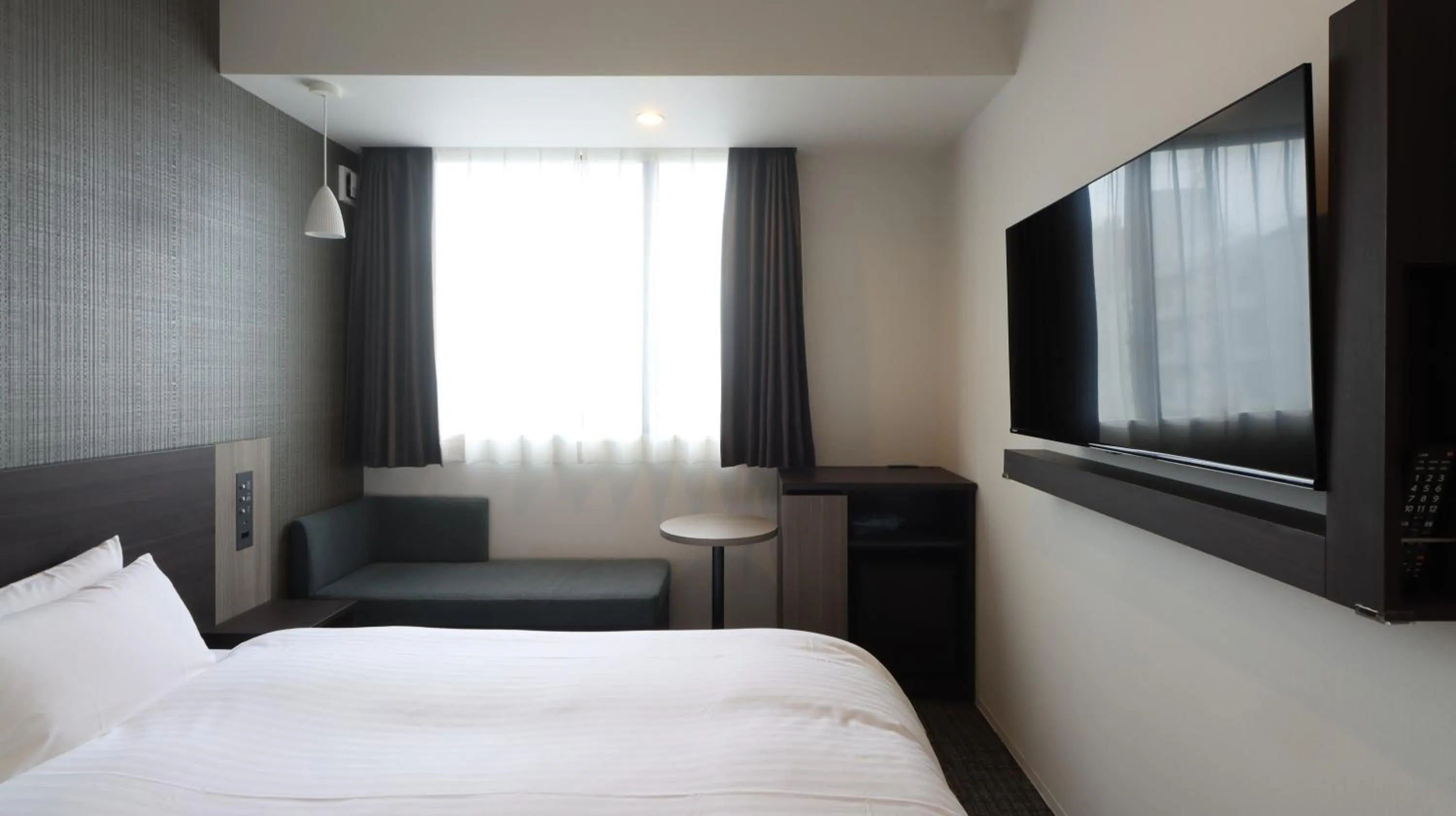 Bed in Wander Kyoto Nanajo