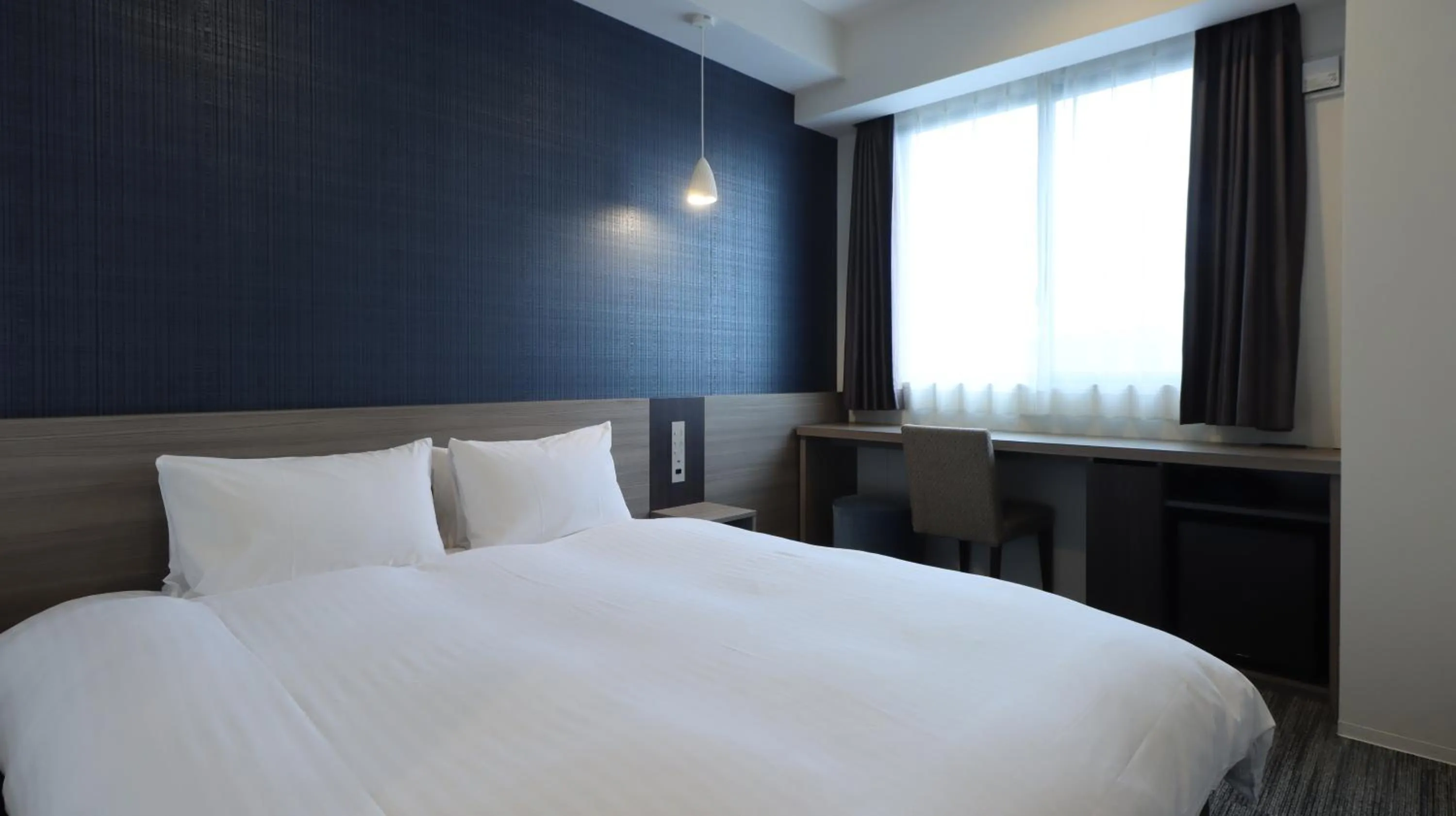 Bed in Wander Kyoto Nanajo