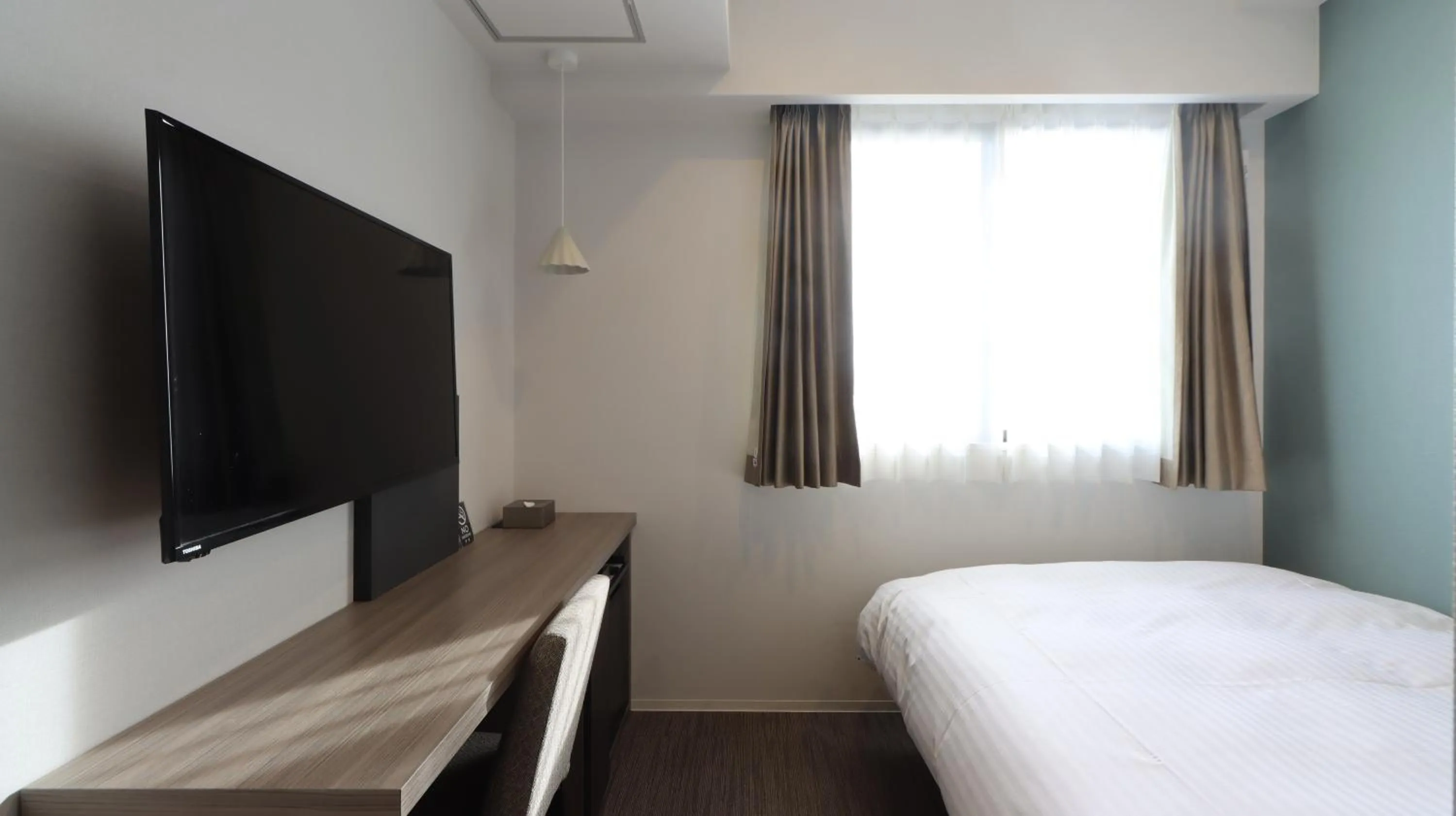 Bed in Wander Kyoto Nanajo