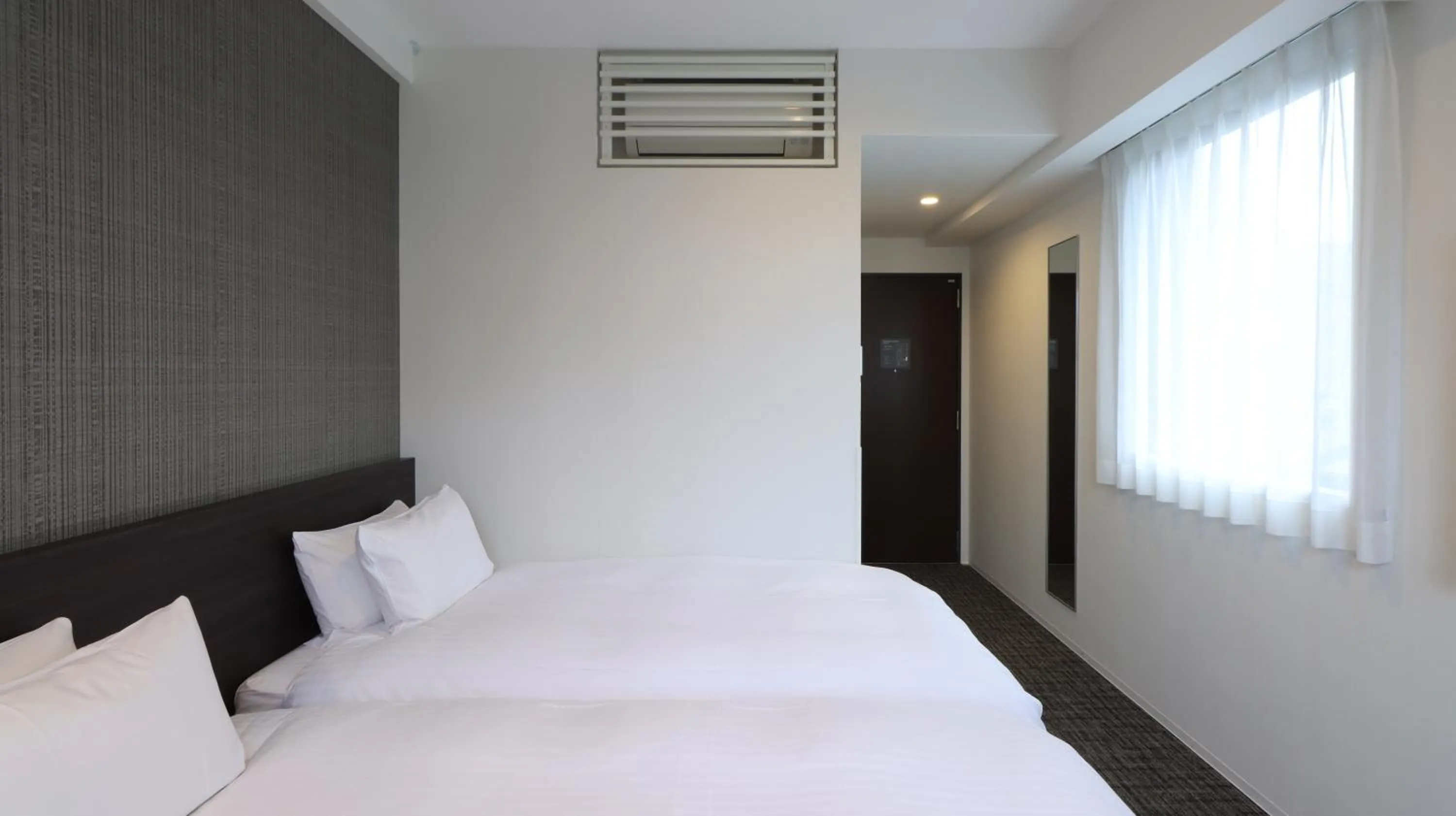 Bed in Wander Kyoto Nanajo