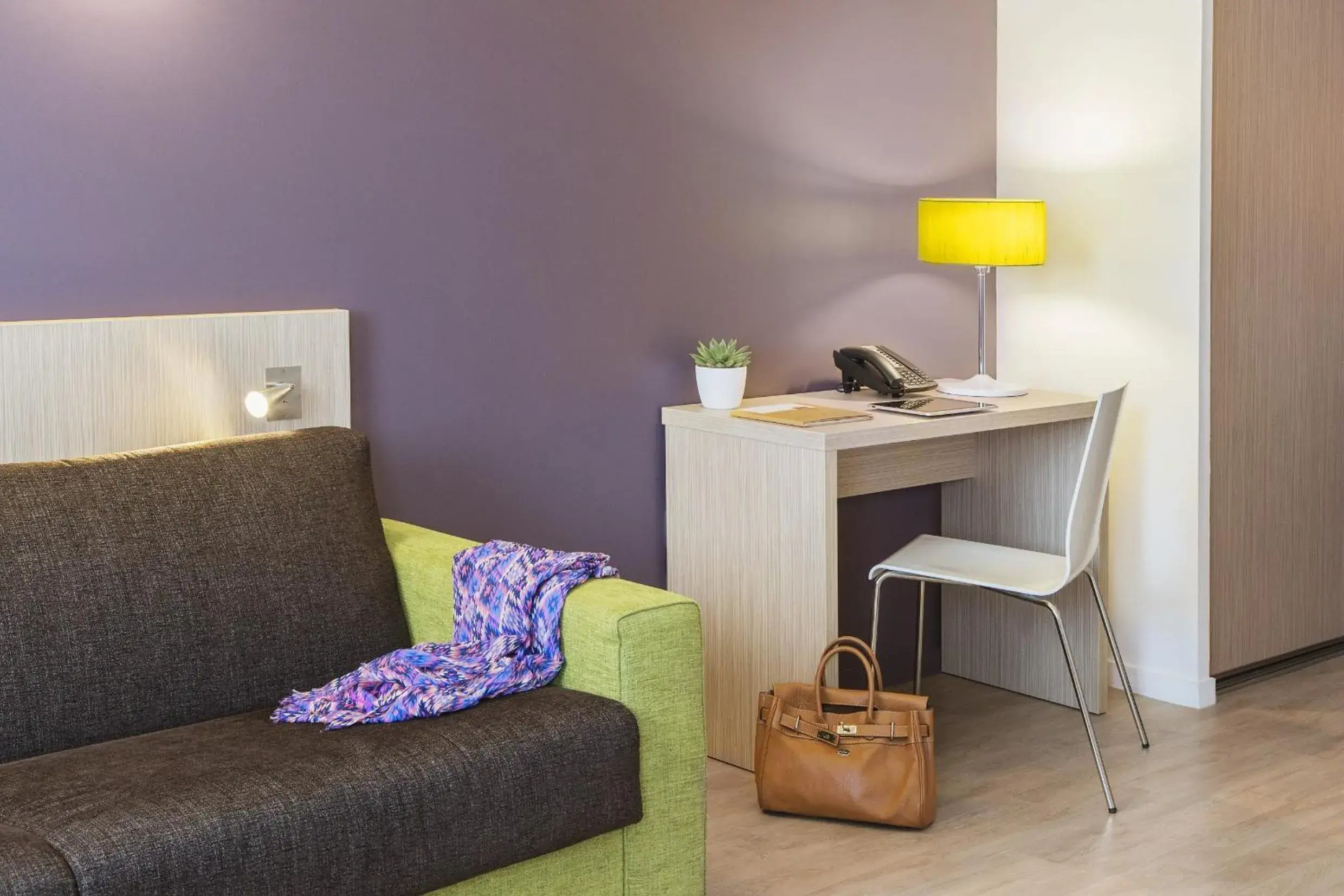 Living room in Aparthotel Adagio Access Paris Clichy Living room in Aparthotel Adagio Access Paris Clichy