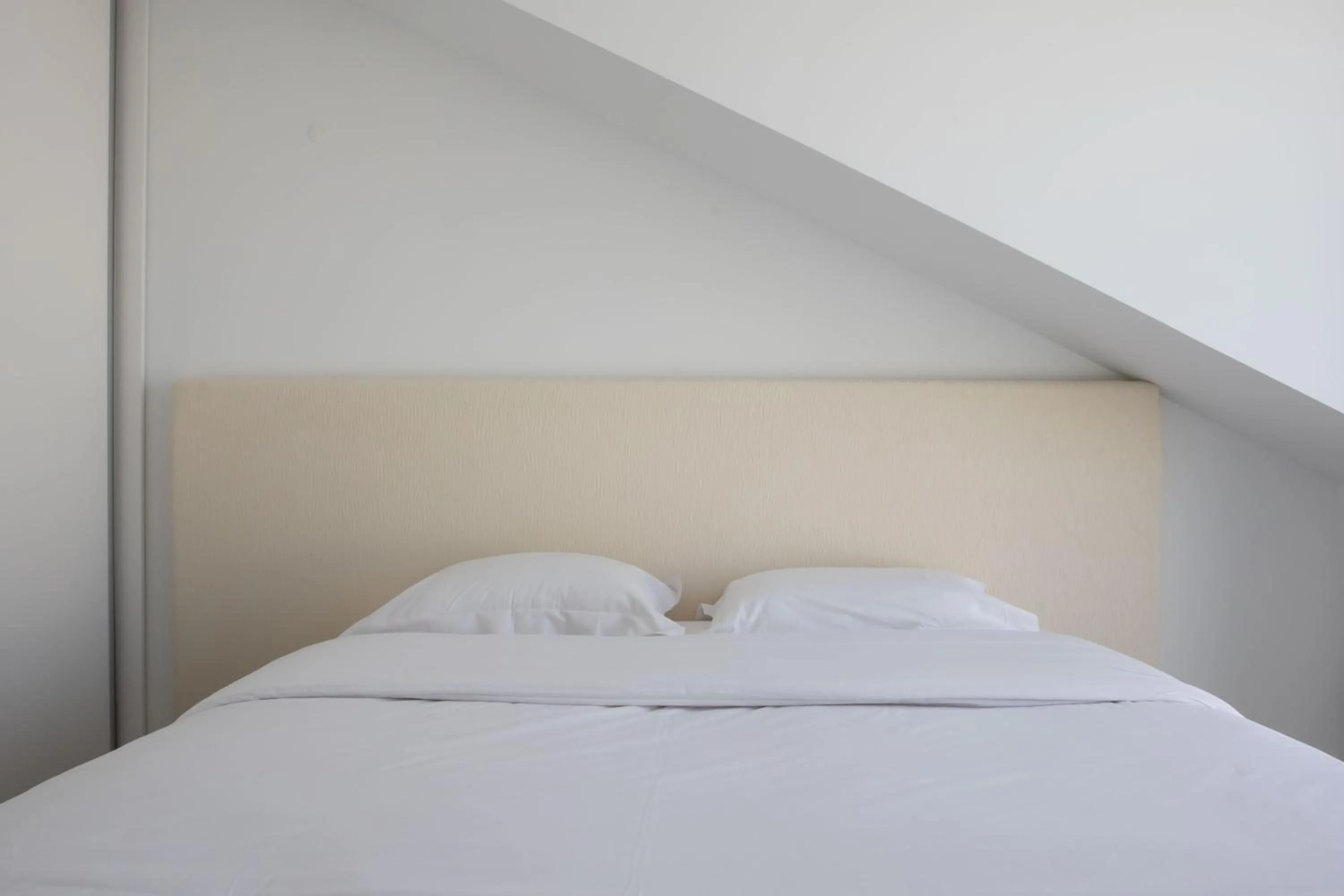 Bed in Oscar Concept Apartments