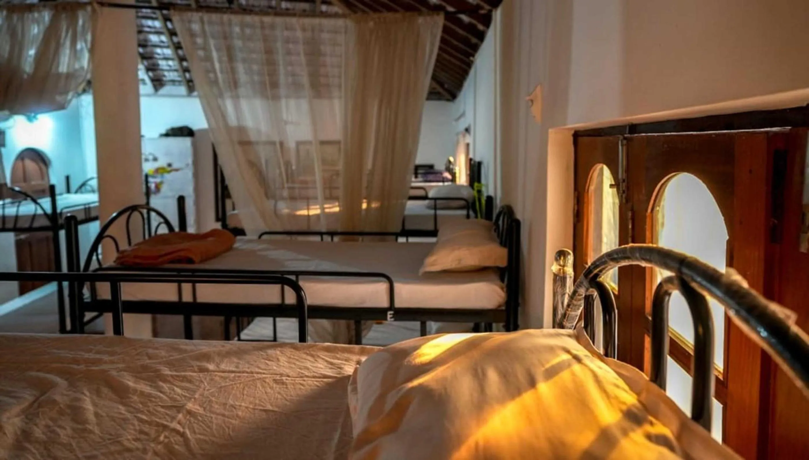 Seating area, Bed in Anjoned Hostel & Cafe