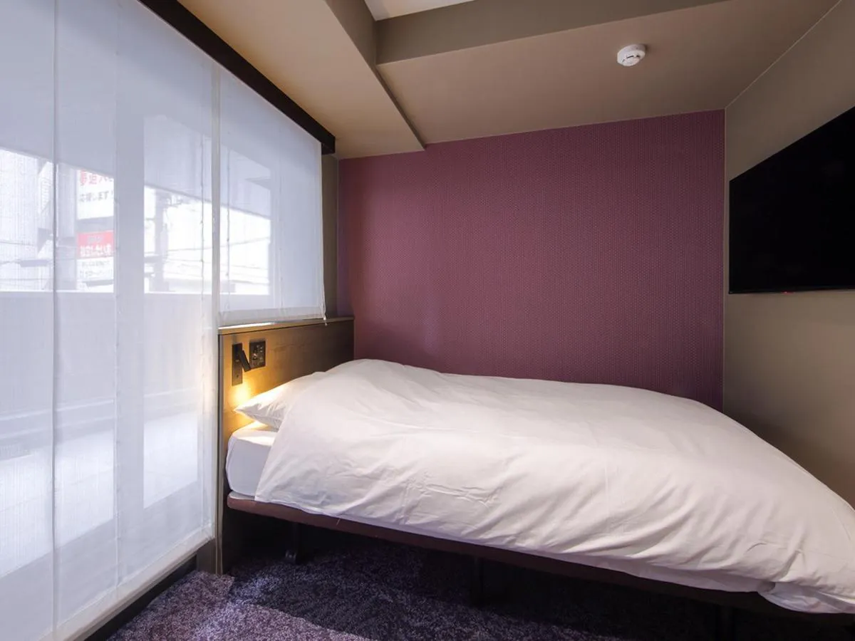 Bed in Hotel SUI Kobe Sannomiya by ABEST