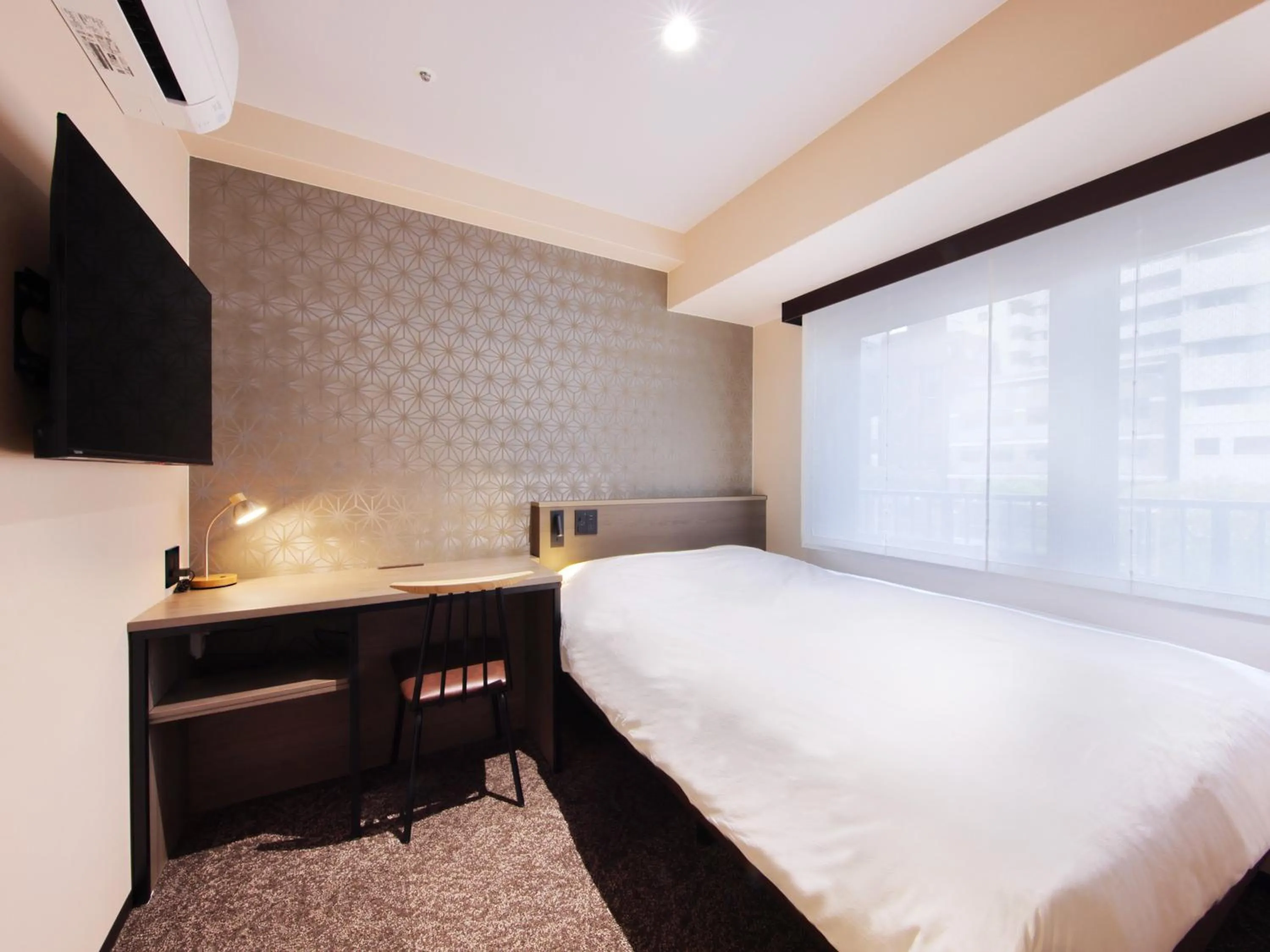 Photo of the whole room, Bed in Hotel SUI Kobe Sannomiya by ABEST