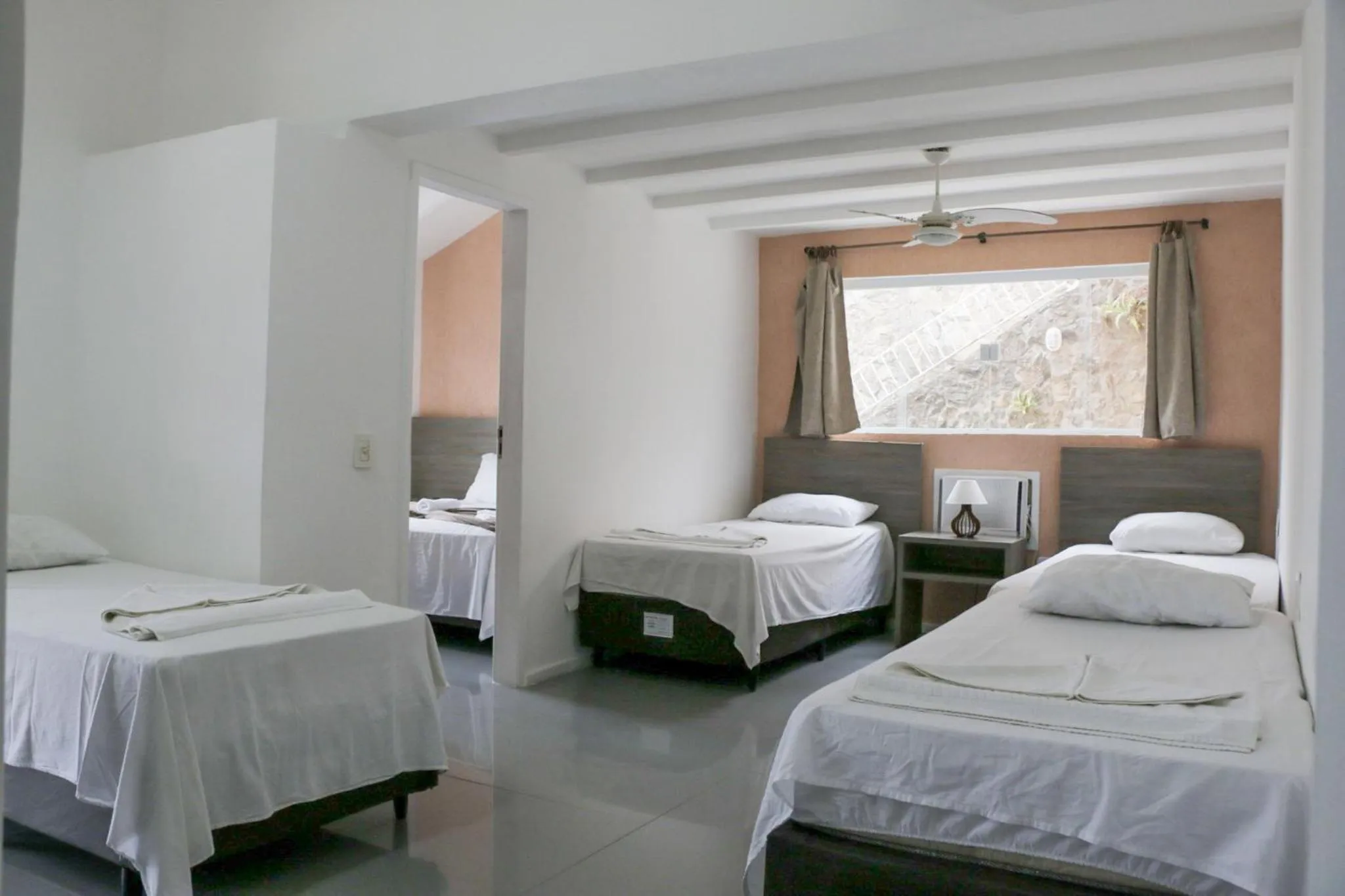 Bed in Tarumã Búzios Hotel