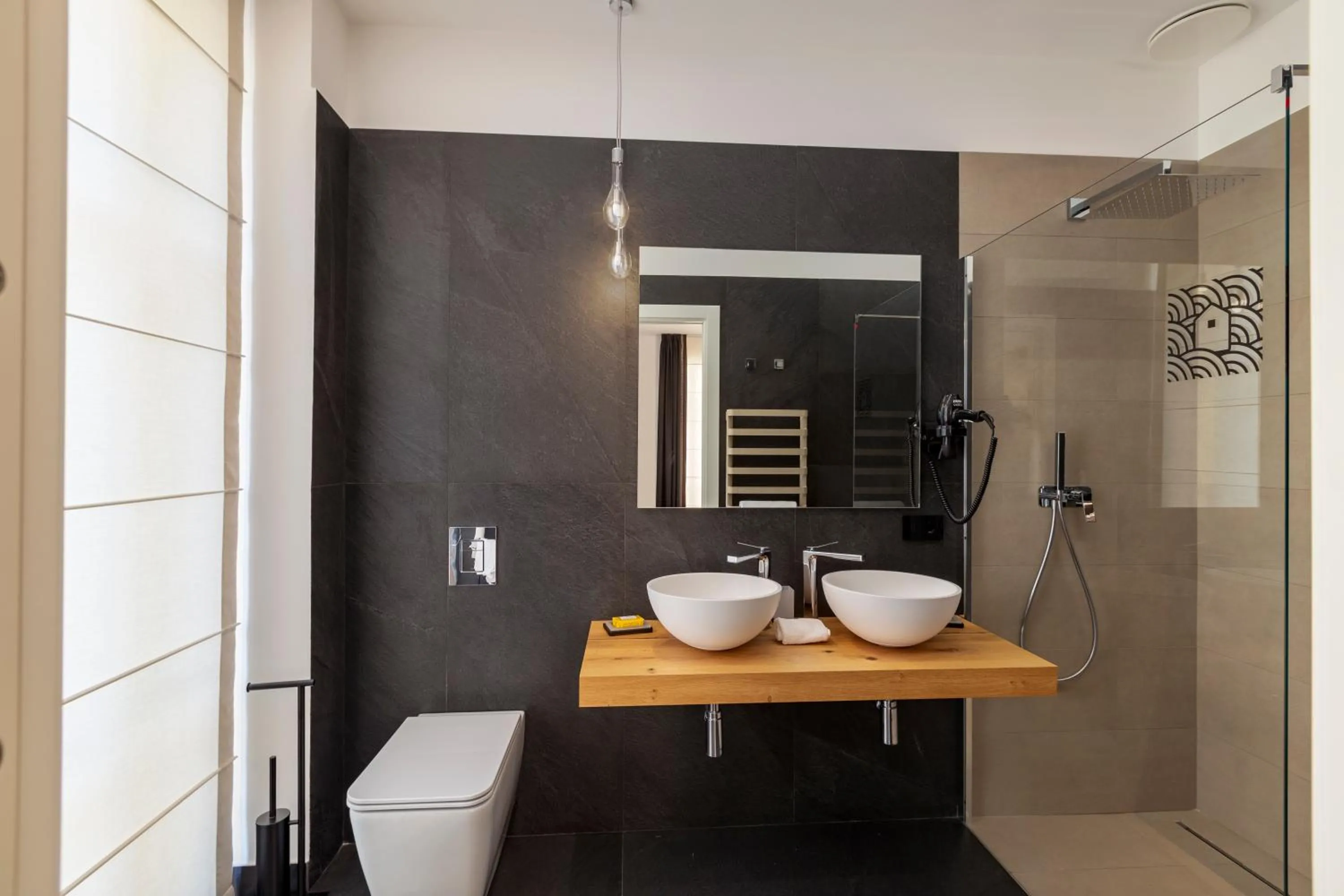 Bathroom in Qui Vicino boutique rooms and suites
