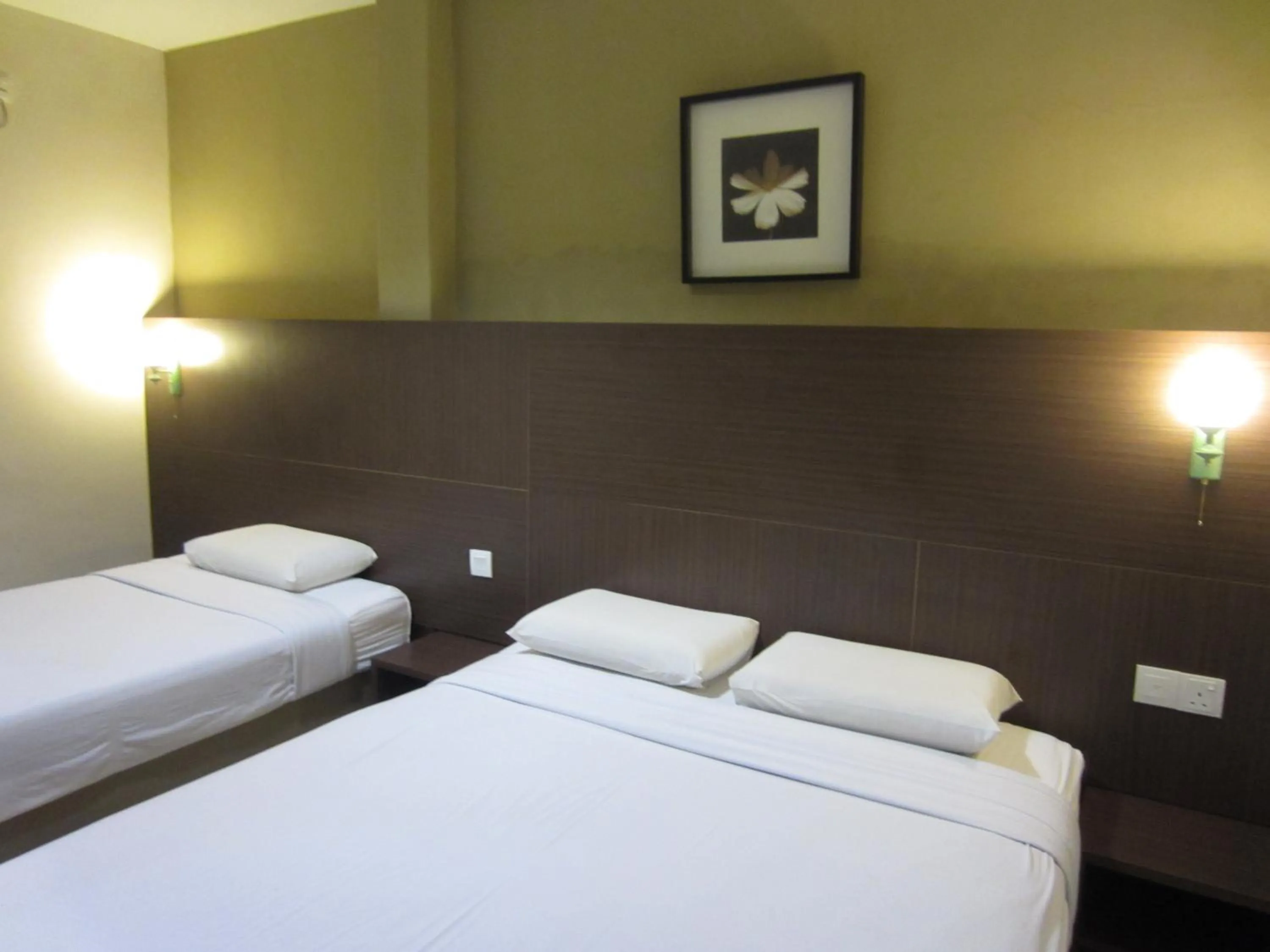 Bed in Radiant Hotel