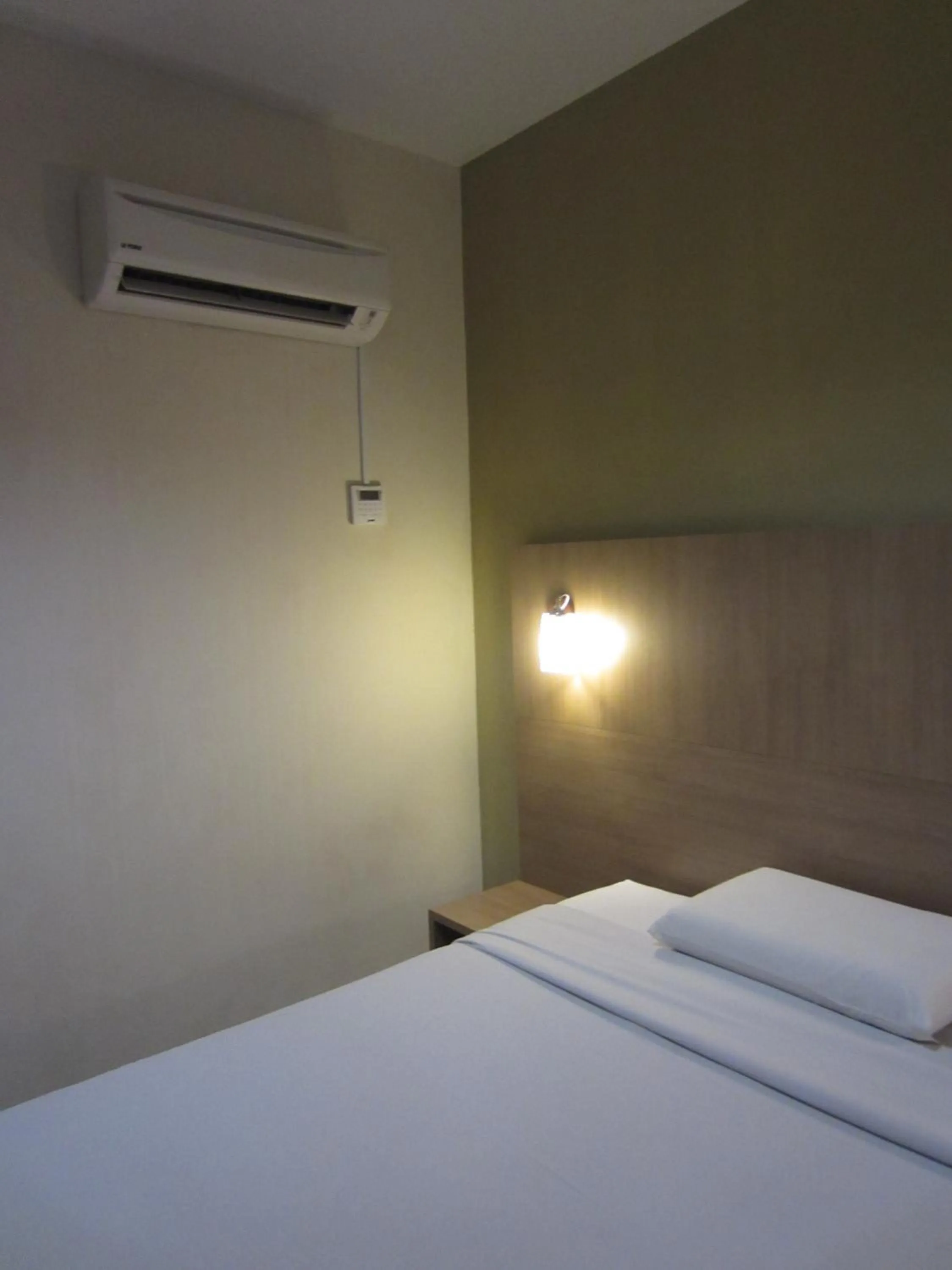 Bed in Radiant Hotel