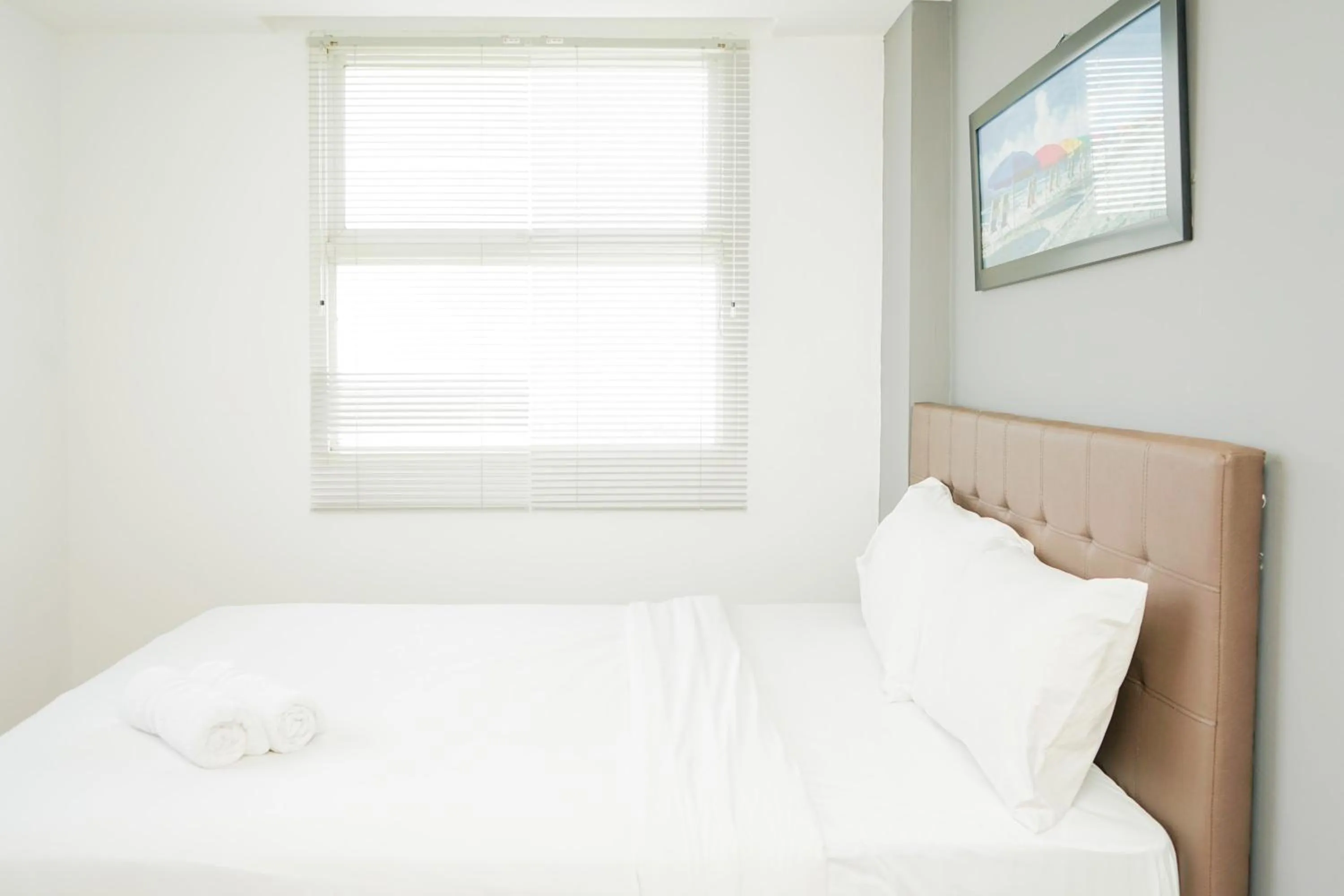 Bed in Cozy 2BR Apartment at Tuscany Residences With Garden View By Travelio