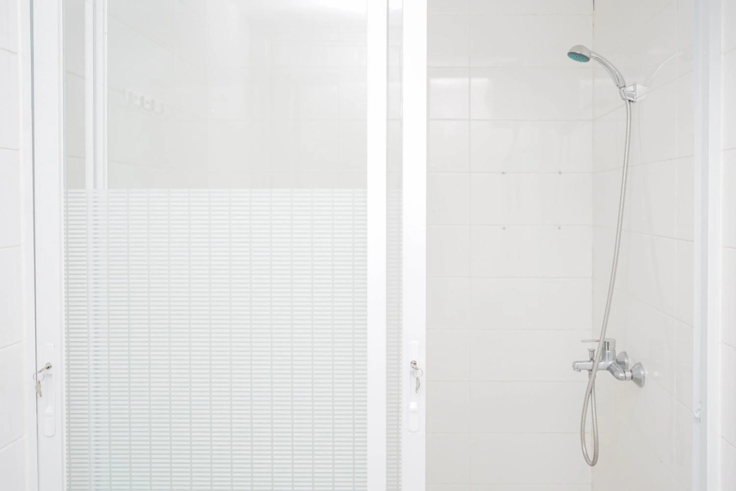 Bathroom in Cozy 2BR Apartment at Tuscany Residences With Garden View By Travelio