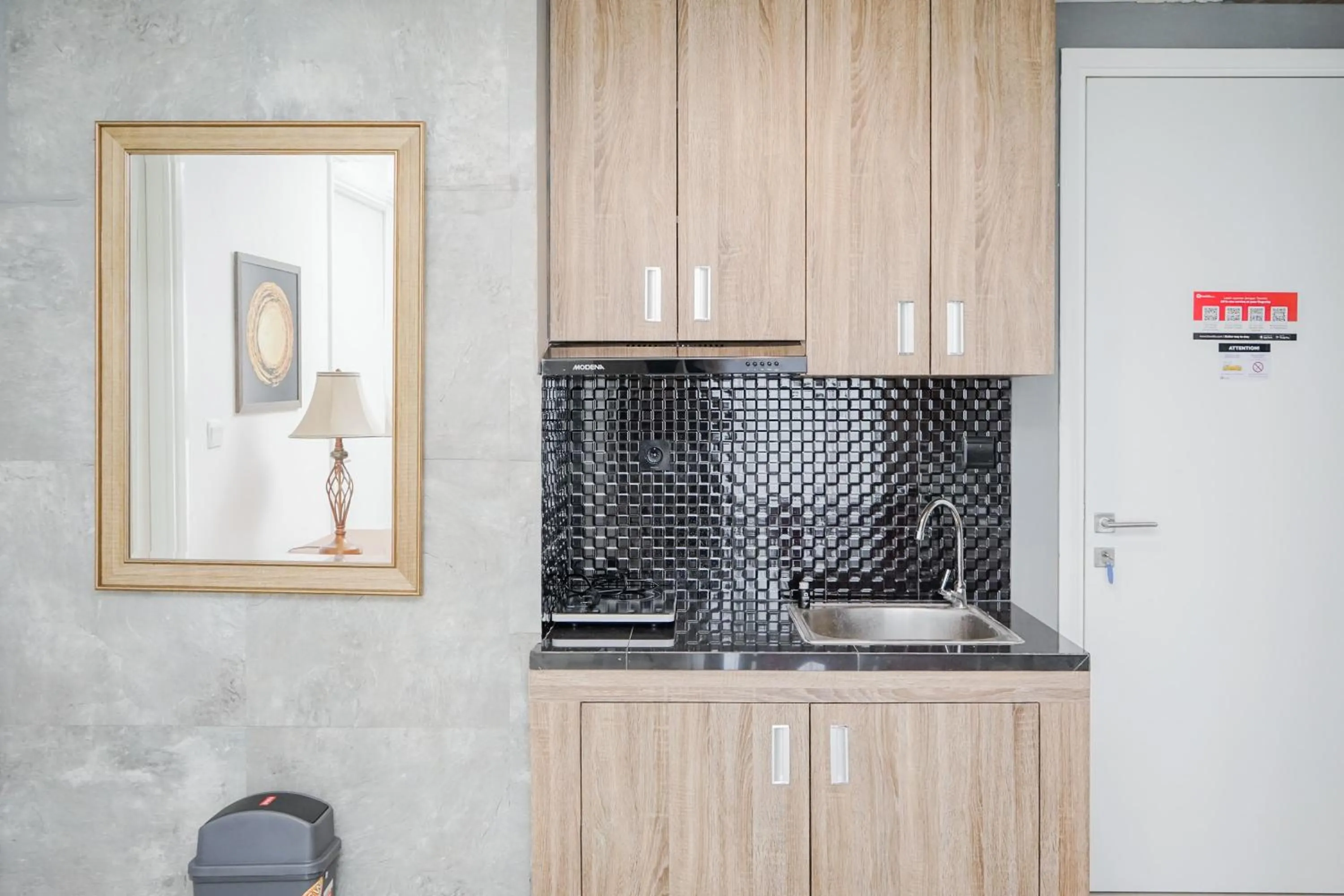 Kitchen or kitchenette in Cozy 2BR Apartment at Tuscany Residences With Garden View By Travelio