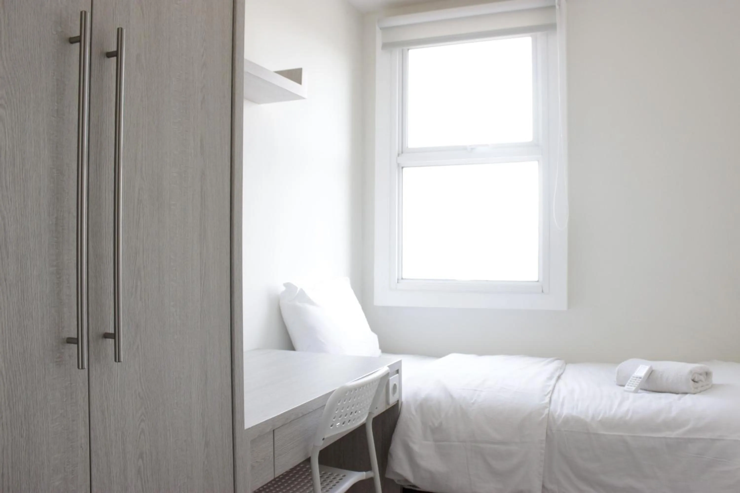 Bed in Spacious 3BR Apartment Parahyangan Residence near UNPAR By Travelio