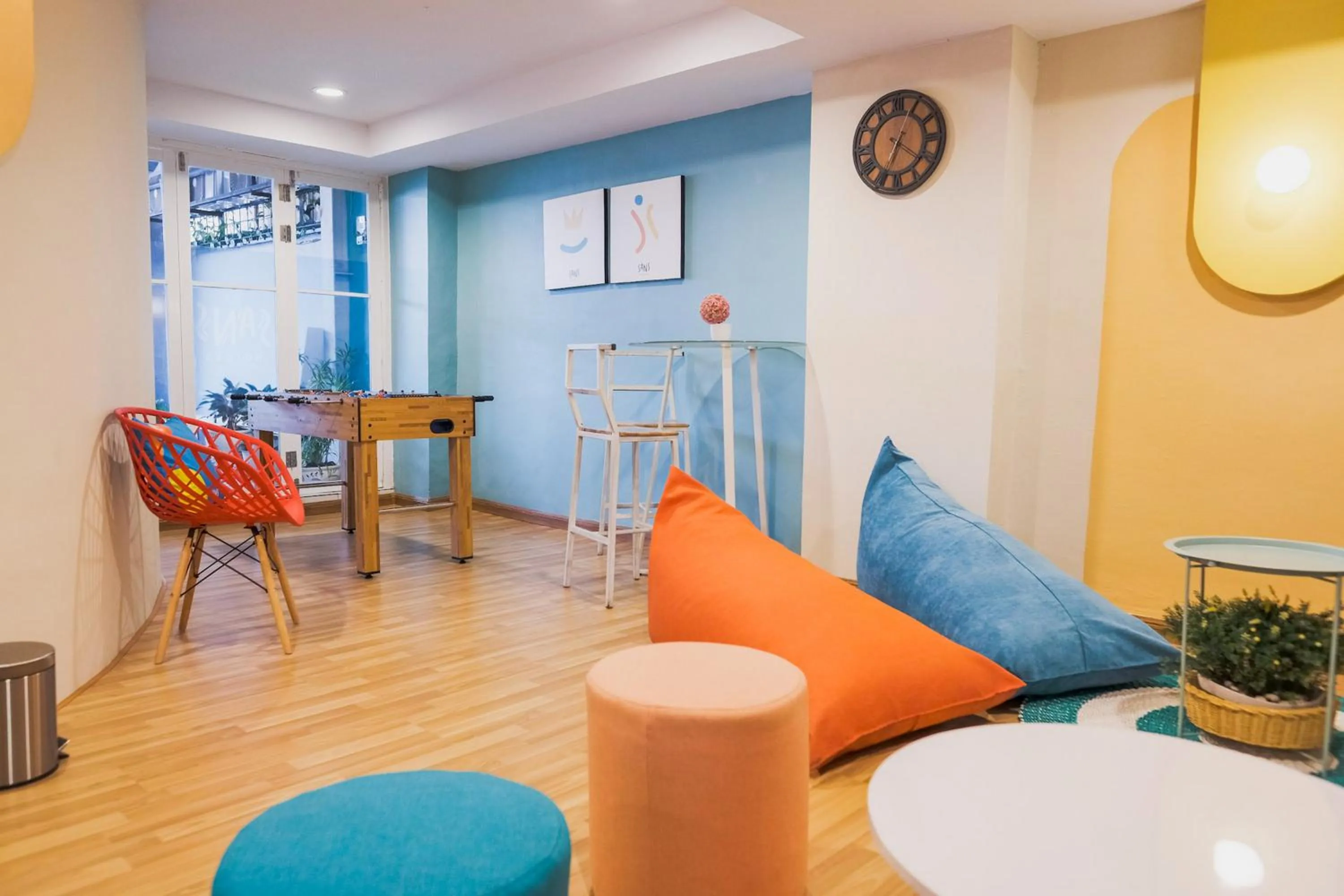 Seating area in Sans Hotel Cemara Asri Medan