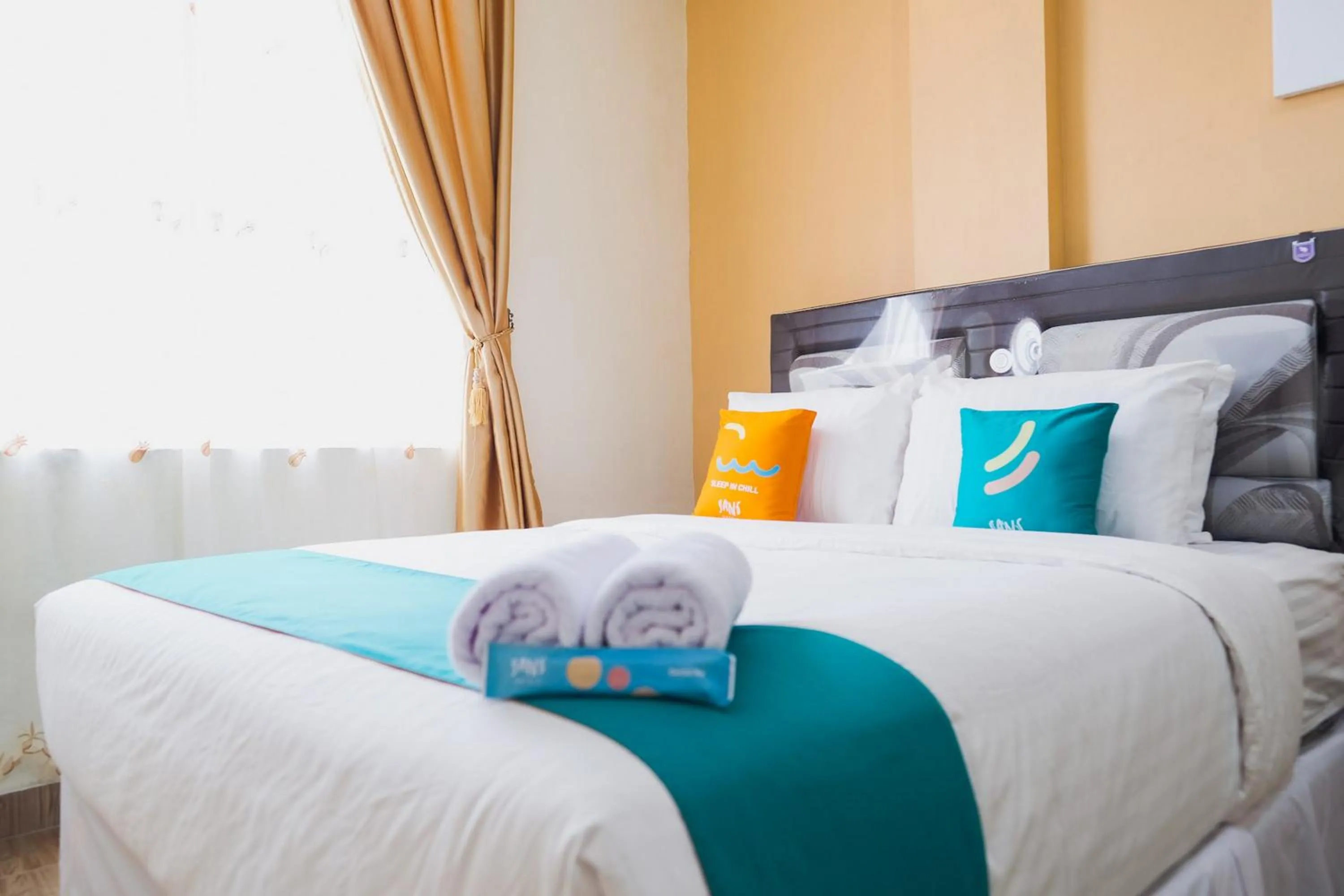 Bedroom, Bed in Sans Hotel Cemara Asri Medan