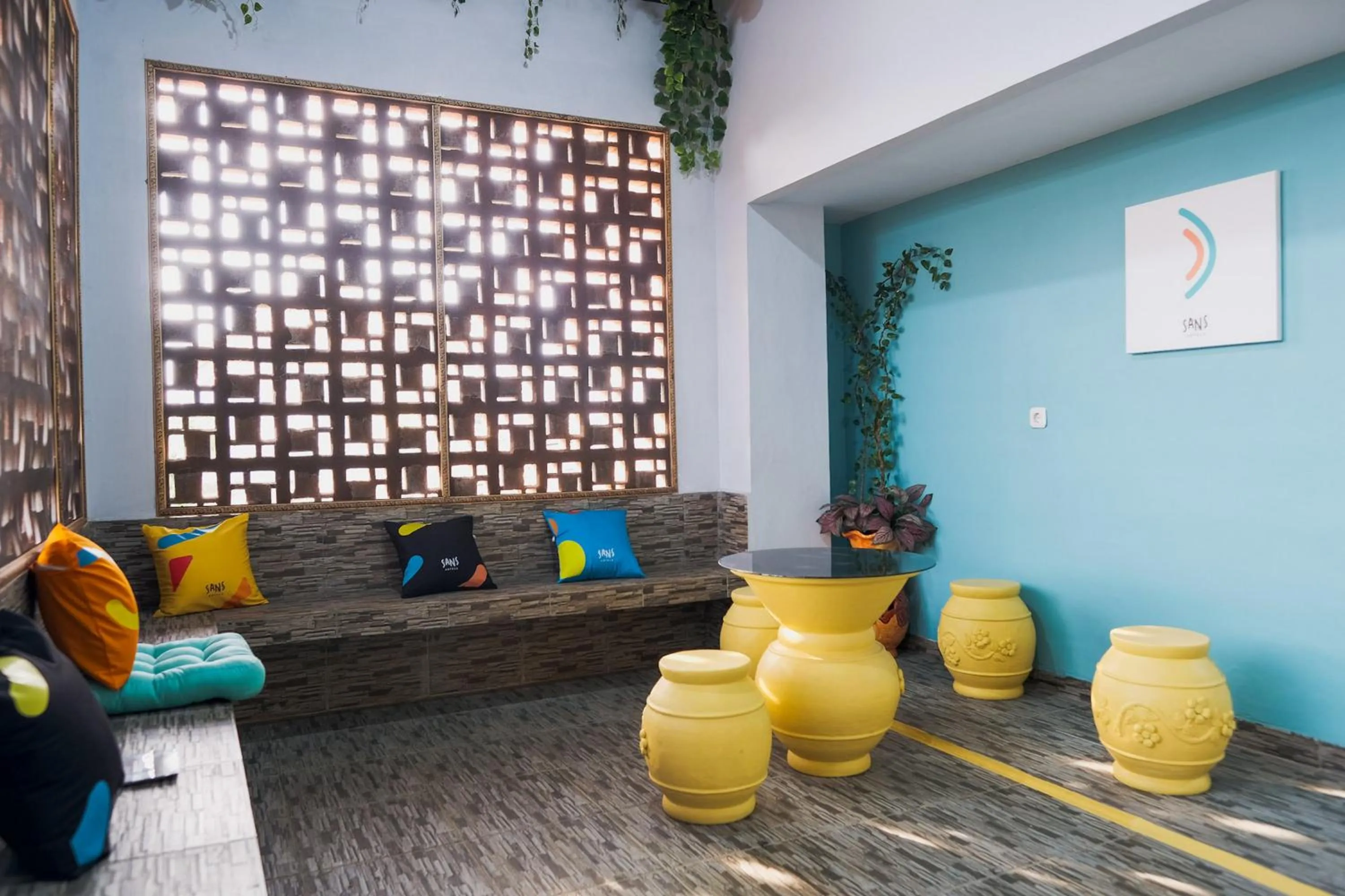 Seating area in Sans Hotel Cemara Asri Medan