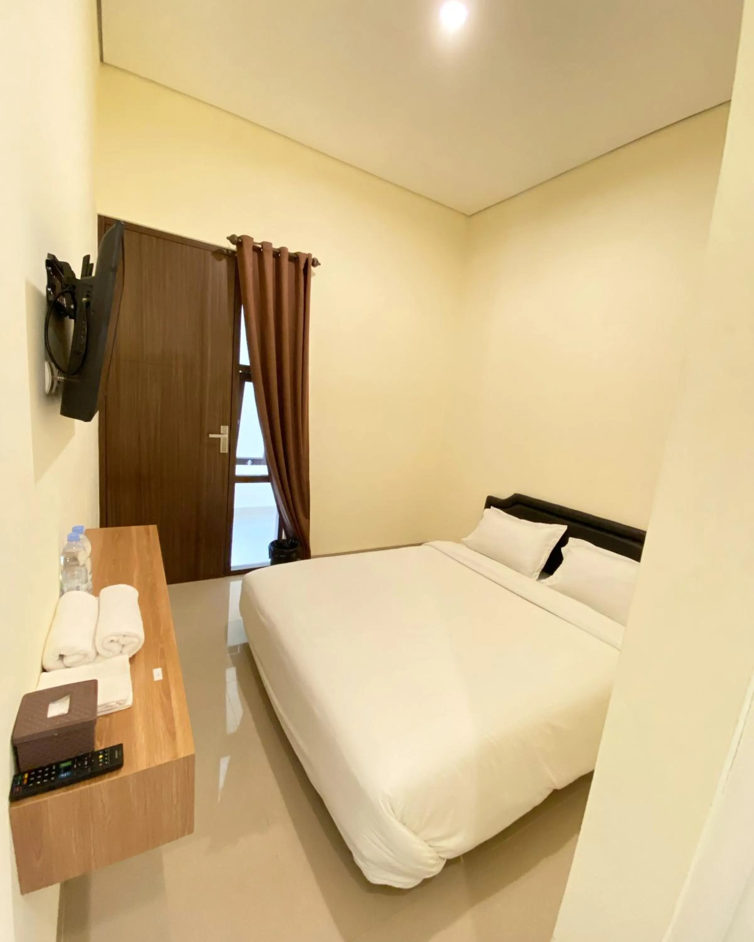Bed in RedDoorz at Arkana Seturan Pakuwon Mall