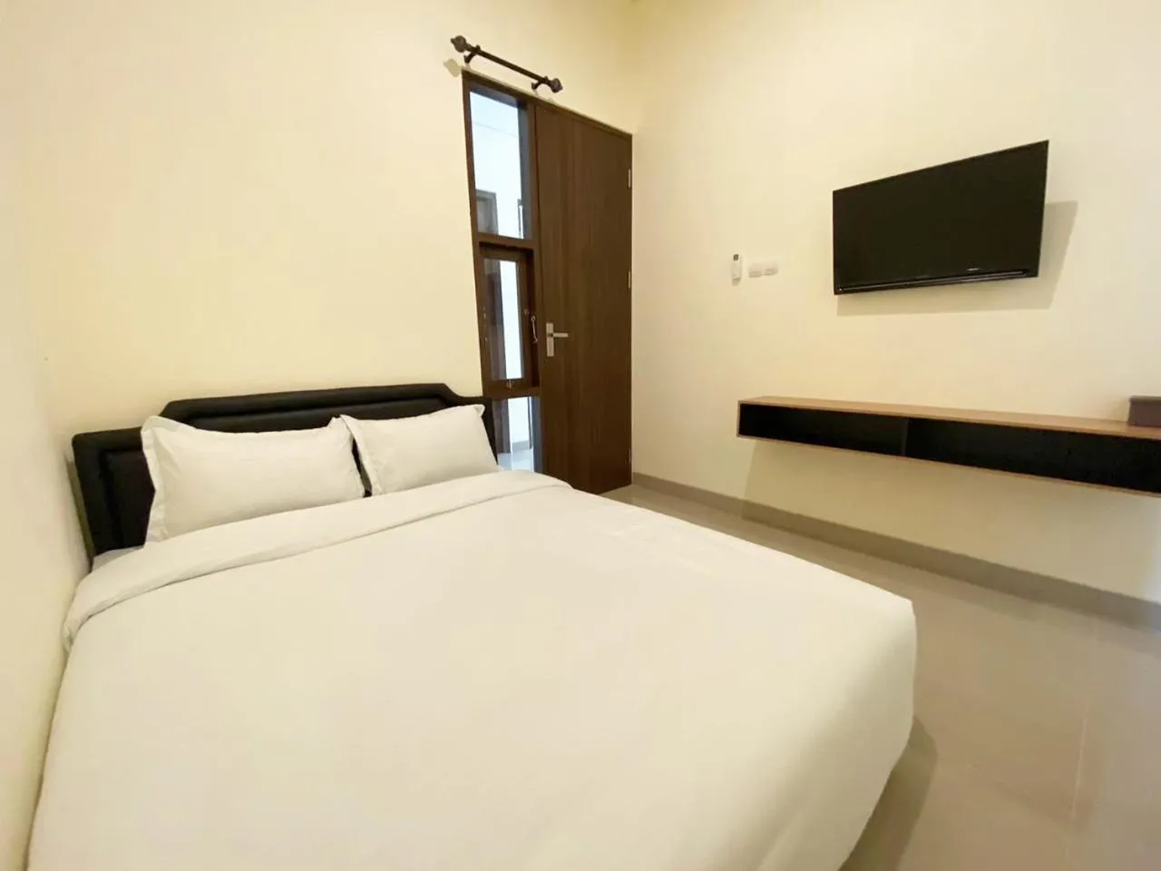 Bed in RedDoorz at Arkana Seturan Pakuwon Mall
