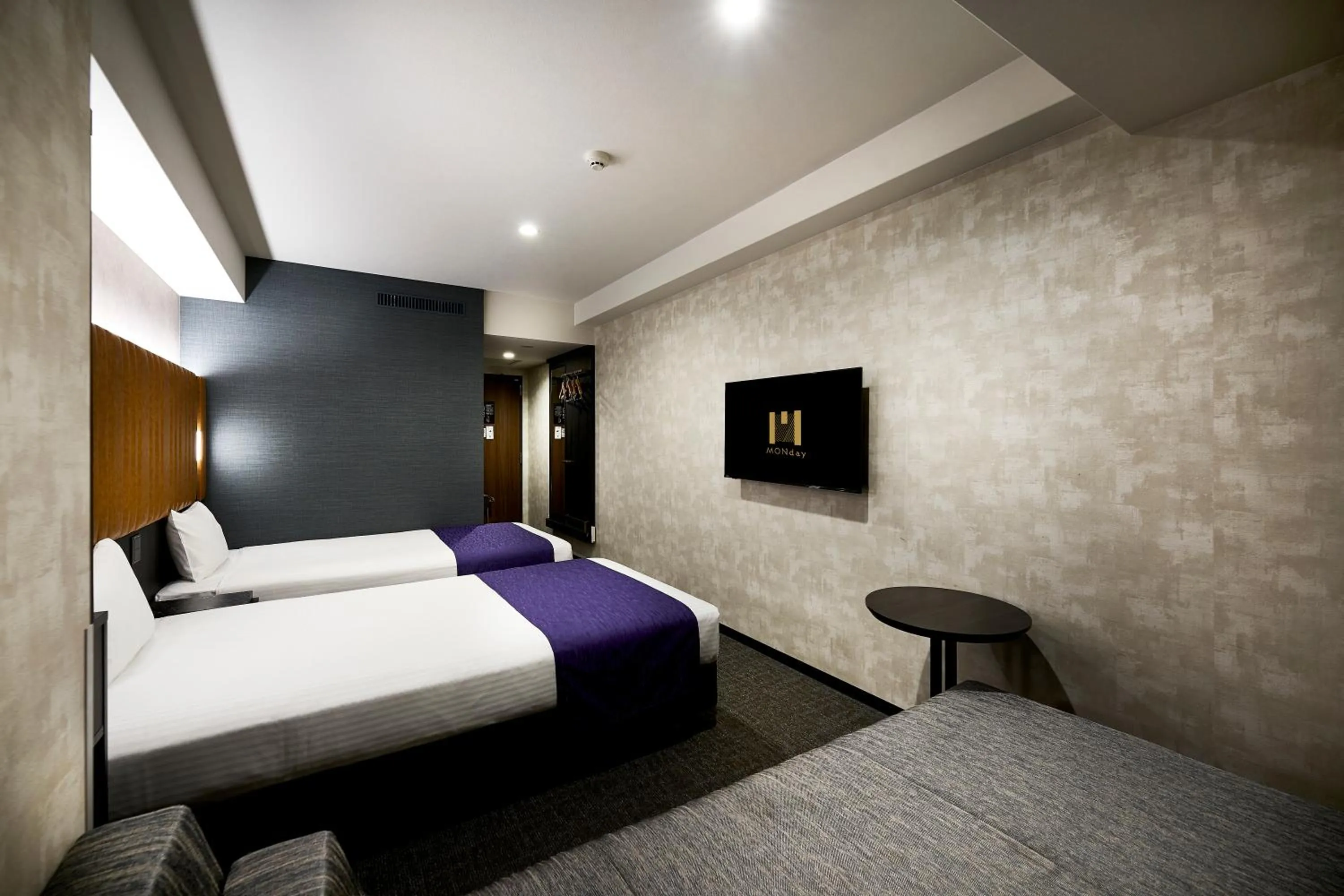 Bed in hotel MONday KYOTO MARUTAMACHI