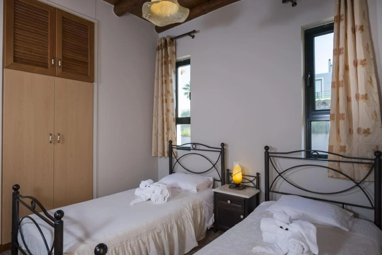 Bed in Athina Luxury Villas