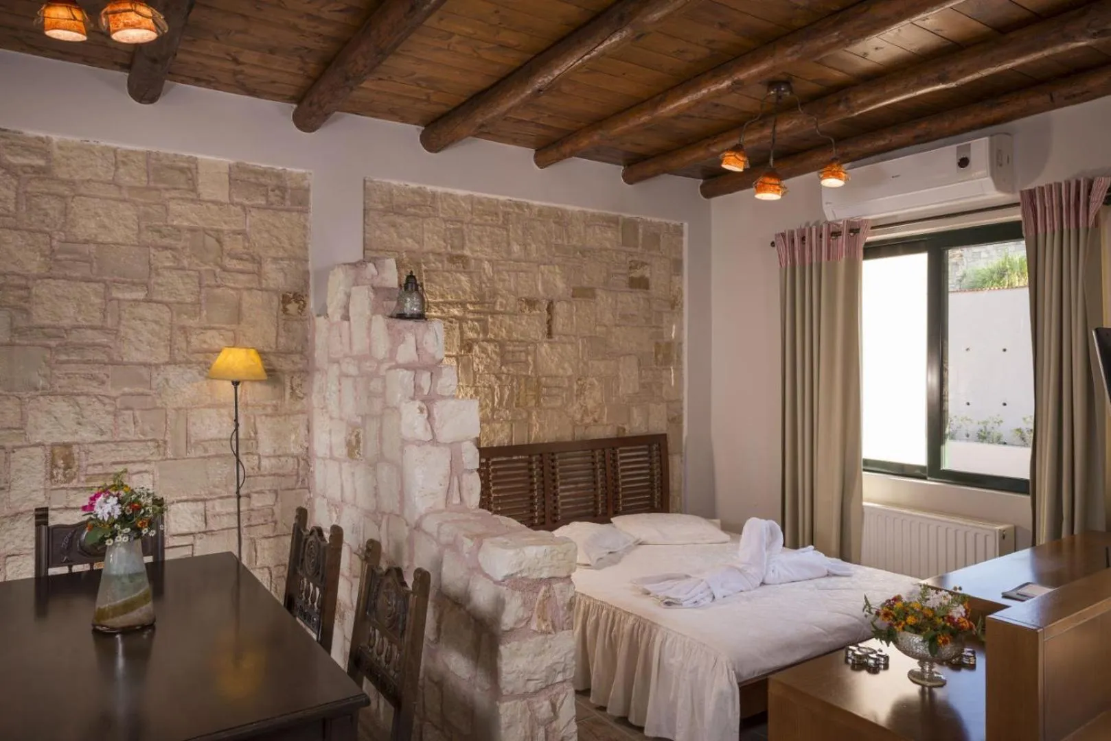Bed in Athina Luxury Villas