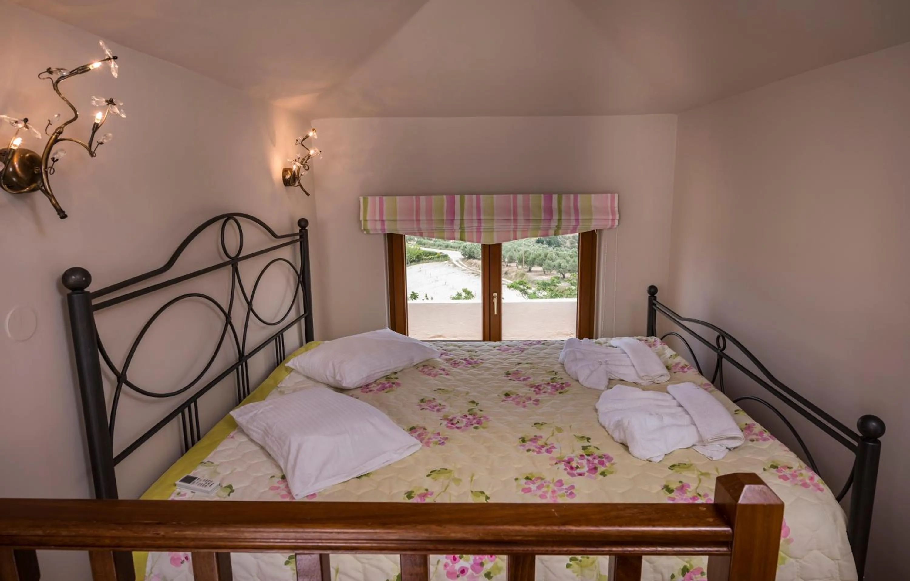 Bed in Athina Luxury Villas
