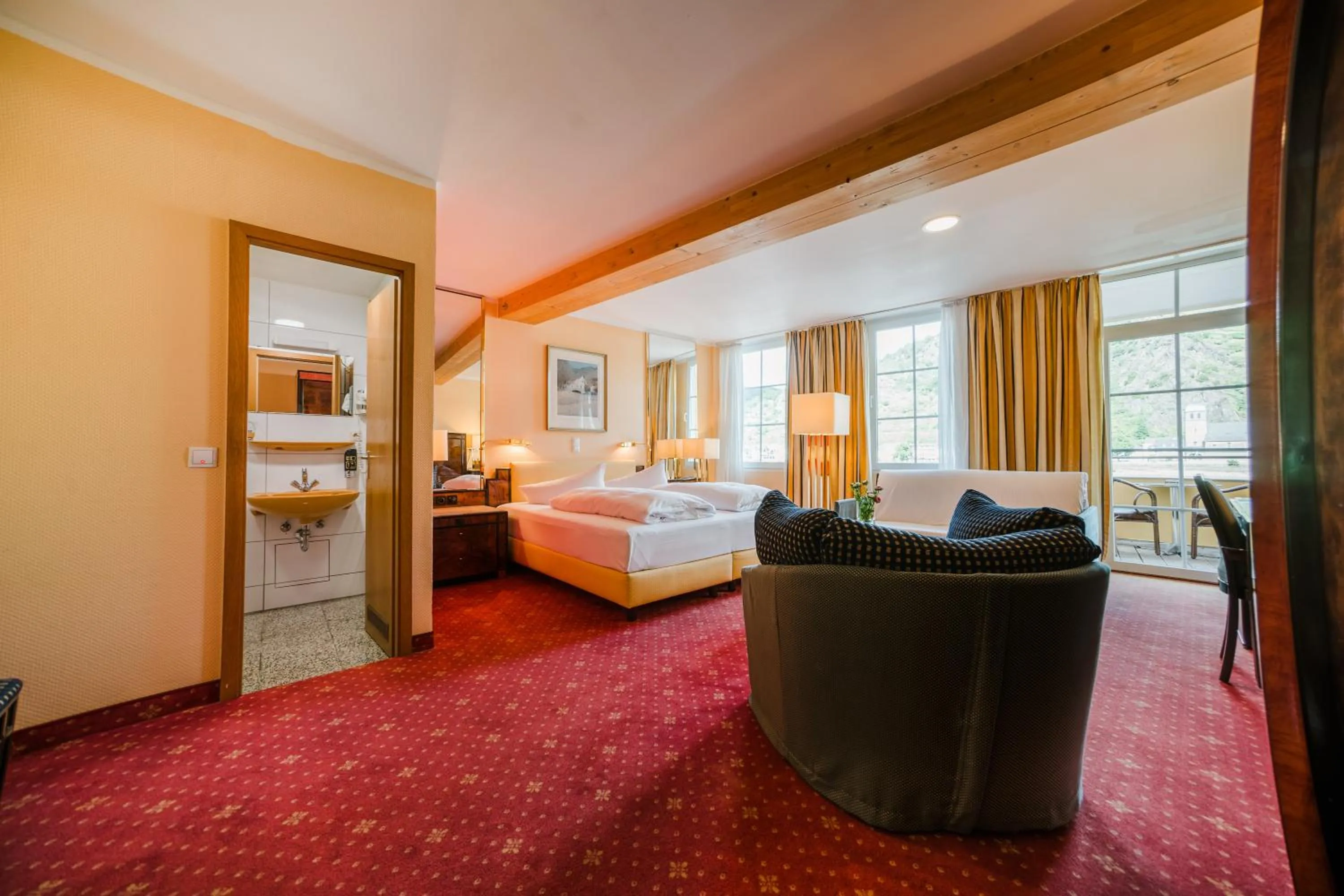 Photo of the whole room, Bed in Hotel Rheinfels