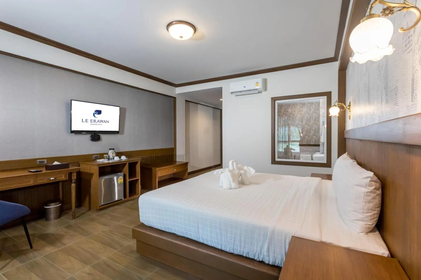 Bed in Le Erawan Phang Nga Hotel